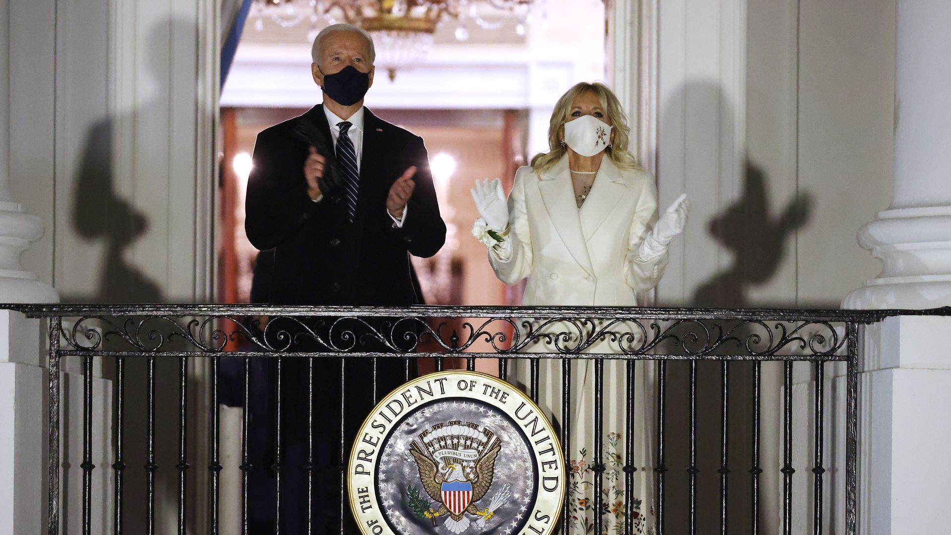 President Joe Biden and first lady Jill Biden watch a fireworks show on the National Mall from the Truman Balcony at the White House January 20