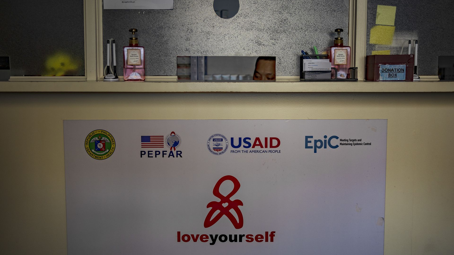 An image of a desk at an office with USAID logo