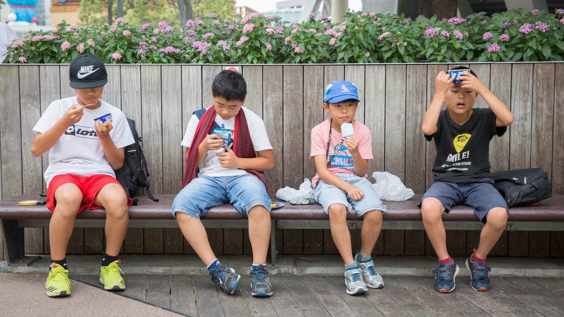 Children eat ice creams as they try and keep cool on July 22, 2018 in Roppongi, Tokyo, Japan.
