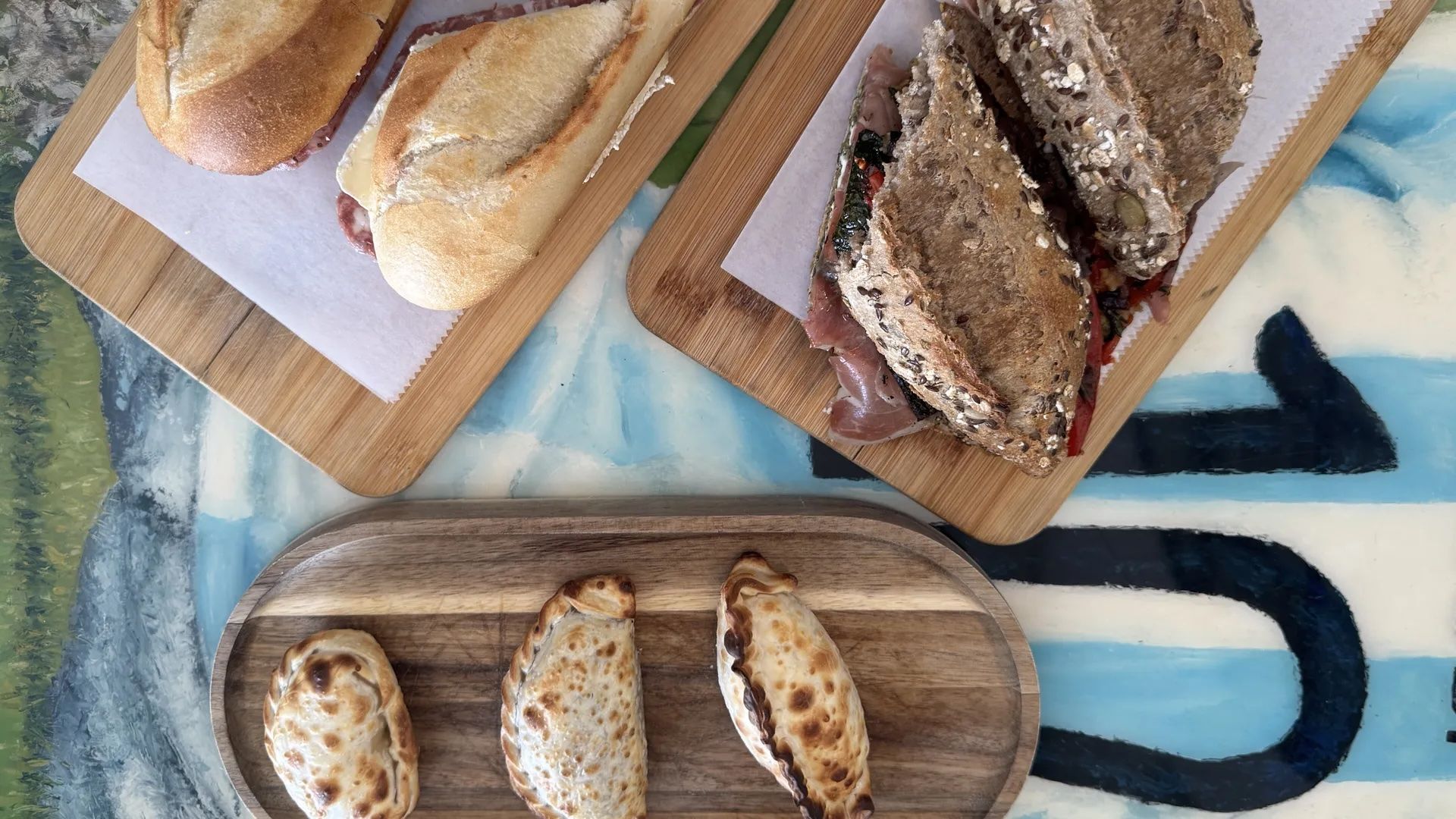 Two sandwiches and three empanadas.