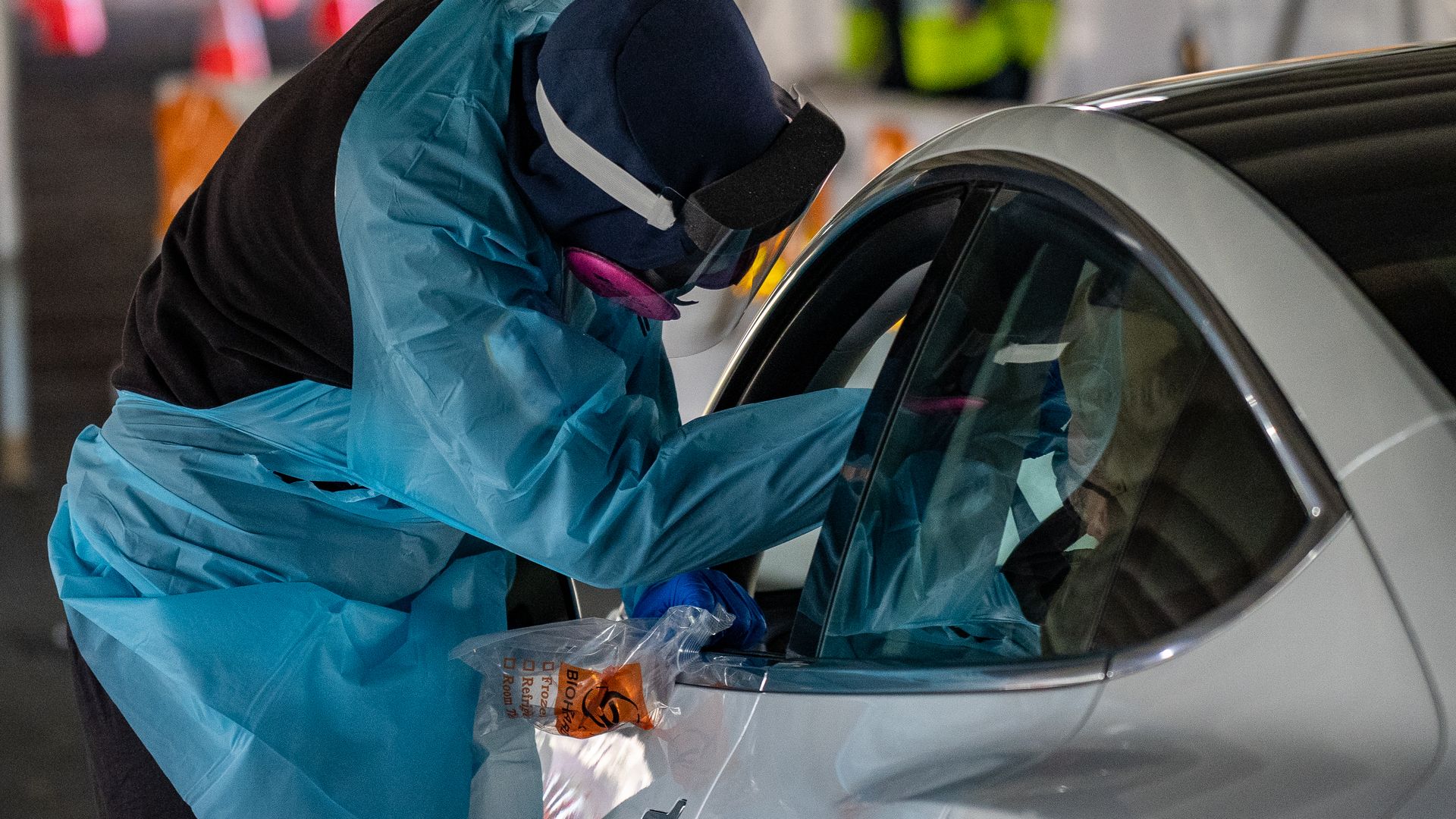 People come to be tested for COVID-19 at a test site