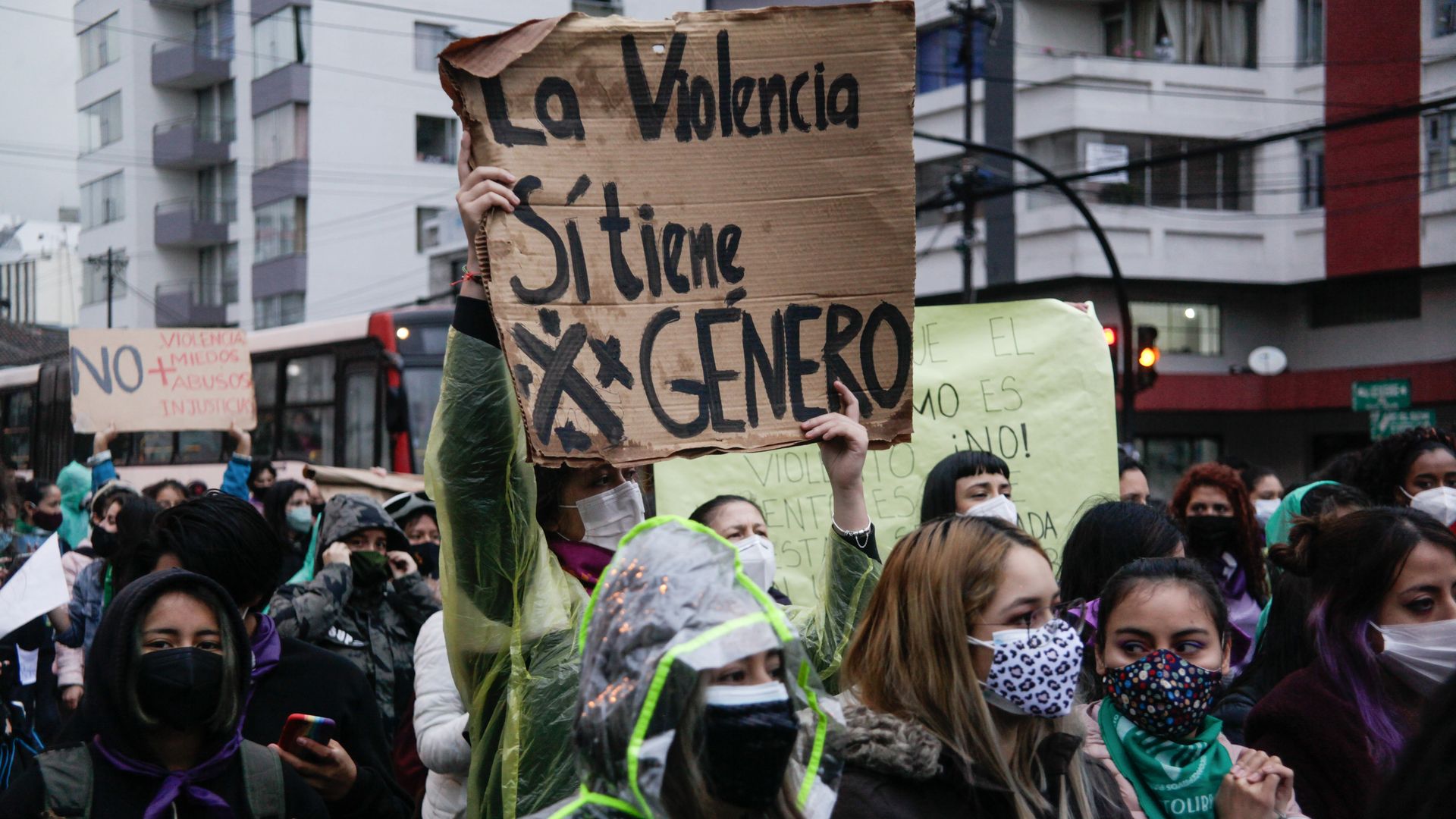  The 2021 A woman holds up a sign in Spanish that translates to "Violence does have gender" at the Women’s Day march in Quito, Ecuador. 