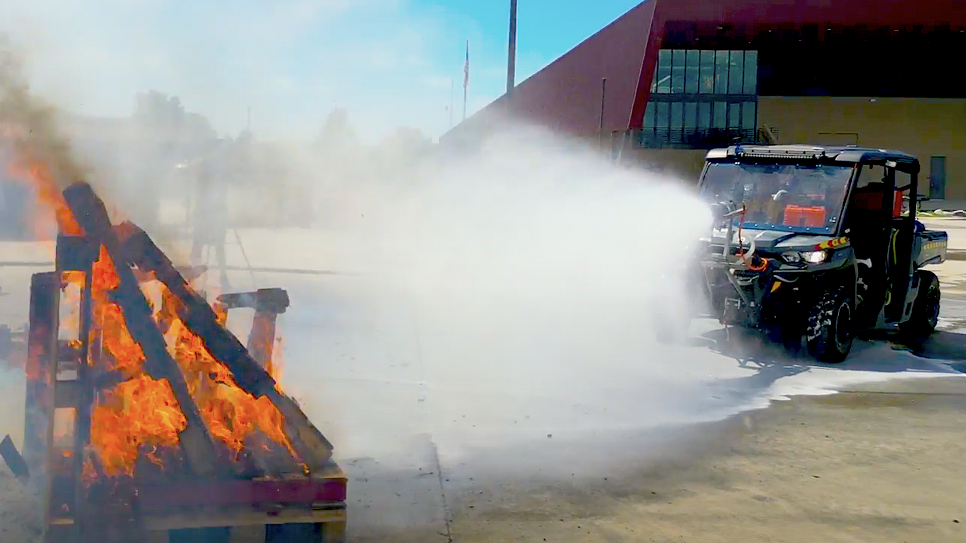 A small jet engine attached to a utility vehicle sprays a test fire.