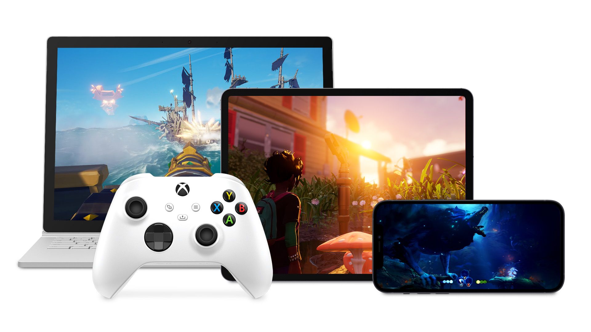 Image of Xbox controller in front of tablets and computers running Xbox games