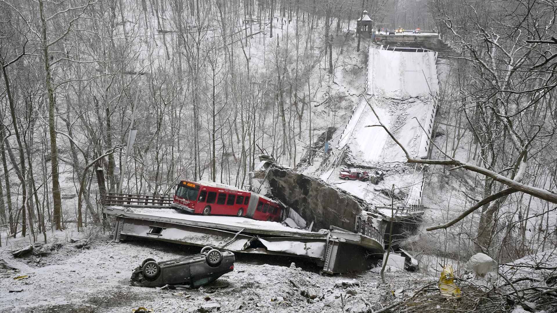 A Port Authority bus that was on a bridge when it collapsed Friday Jan. 28, 2022, is visible in Pittsburgh's East End.