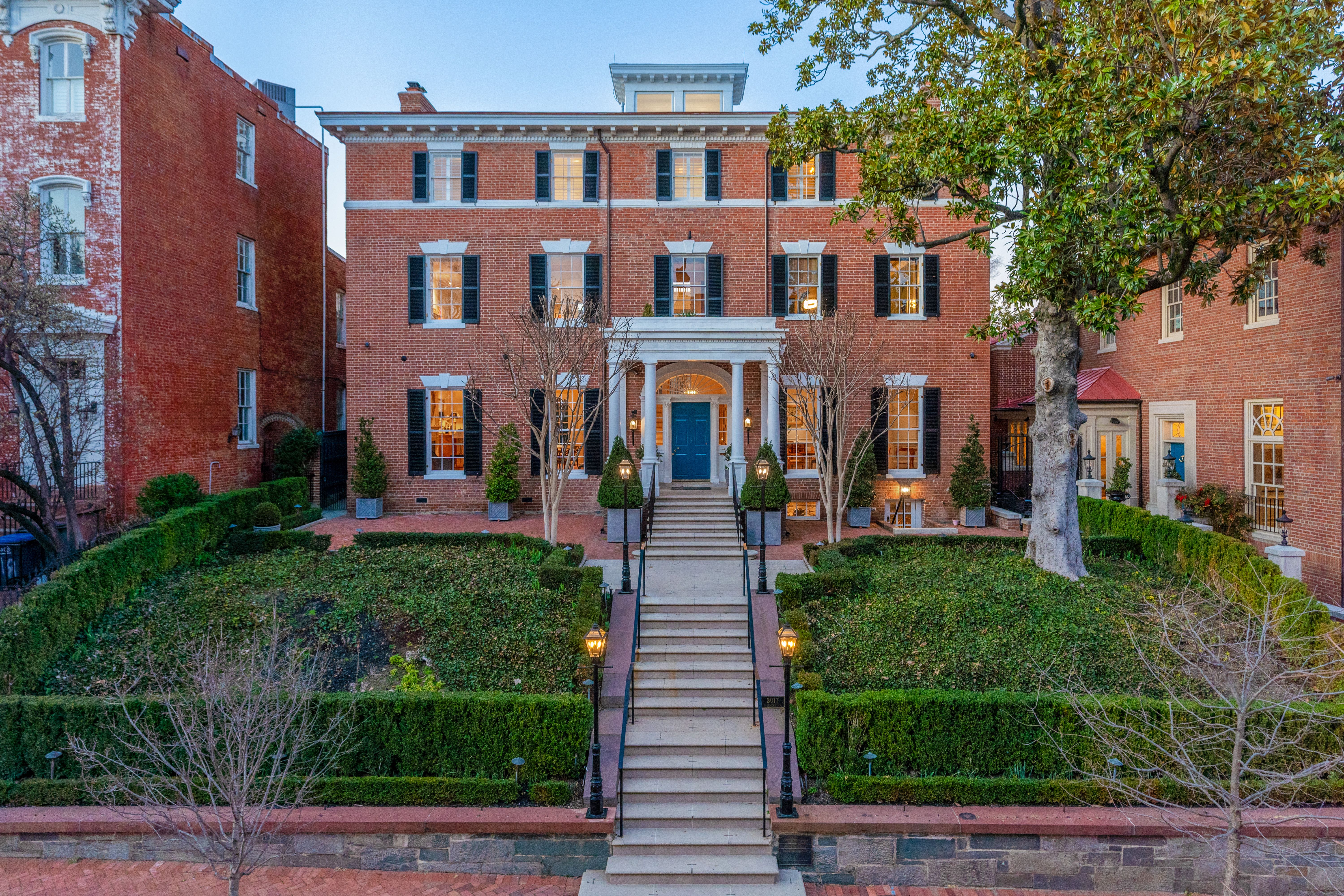 The view of the exterior facade of a large, traditional home in Georgetown.