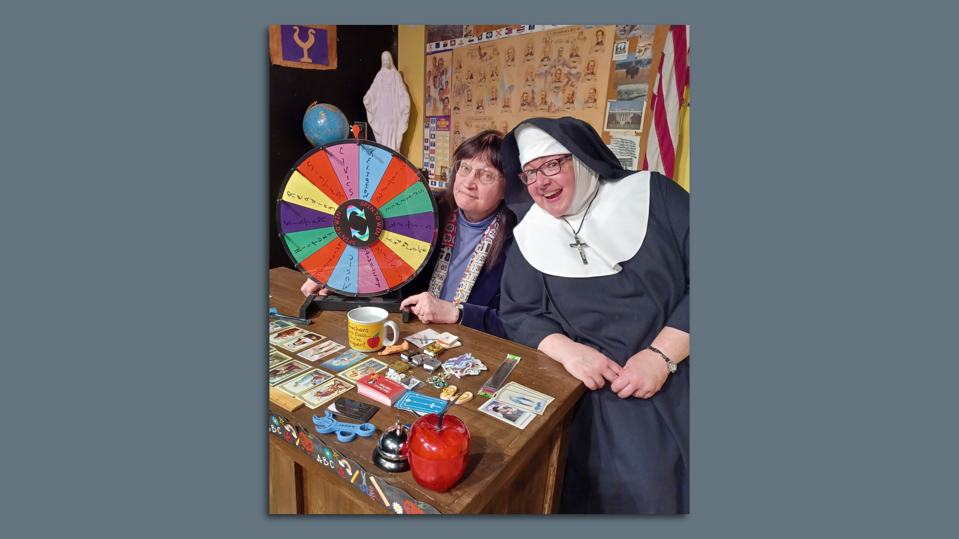Nun and another lady with a game wheel 