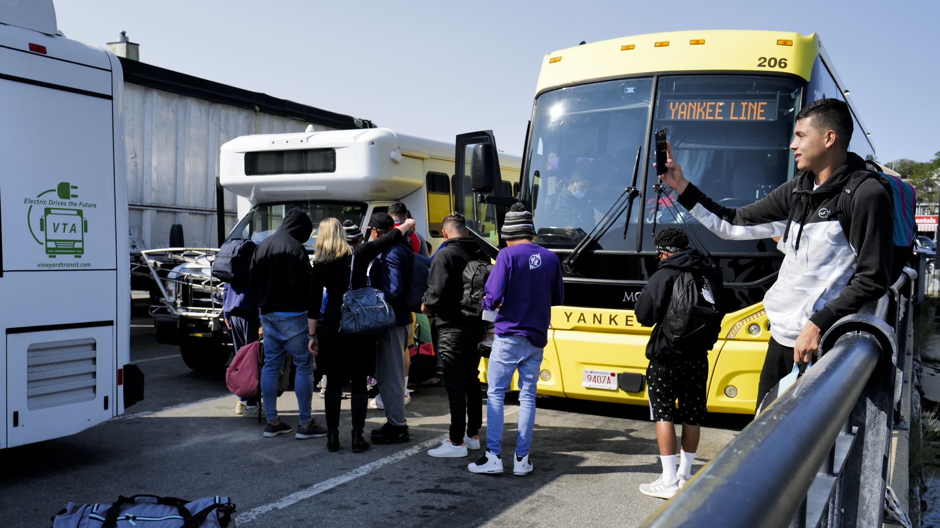 Venezuelan migrants gather at the Vineyard Haven ferry terminal in Marthas Vineyard in September.