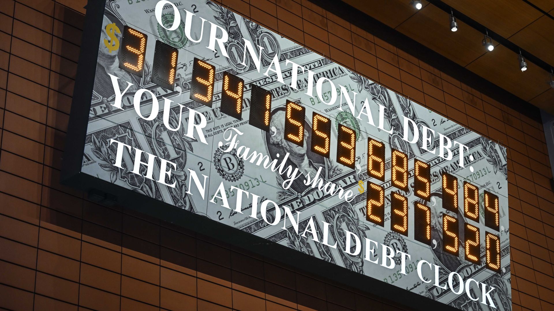 A screen shows the national debt clock after the US hit its debt limit and the Treasury started using "extraordinary measures" to avoid default on January 19, 2023.