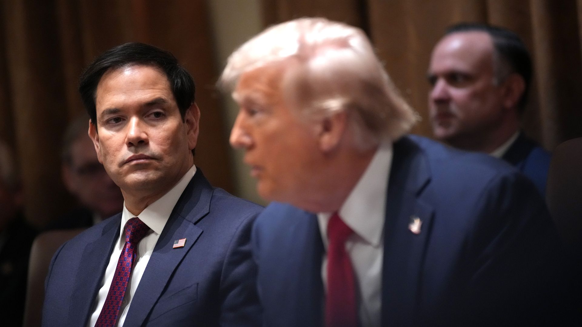 Secretary of State Marco Rubio listens as President Donald Trump delivers remarks during a Cabinet Meeting at the White House on February 26, 2025 in Washington, DC. Trump is holding the first Cabinet meeting of his second term, joined by Tesla and SpaceX CEO Elon Musk, head of the Department of Gov
