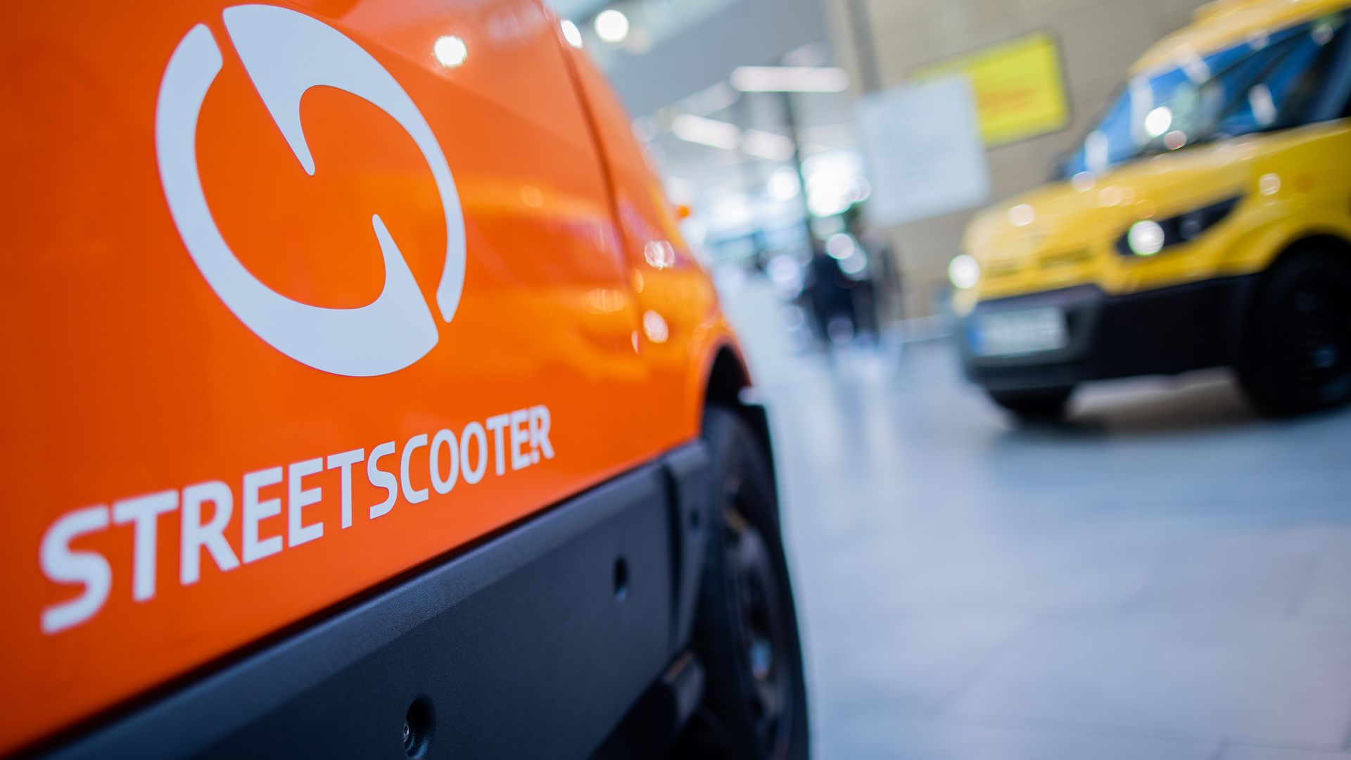 15 May 2019, North Rhine-Westphalia, Bonn: Two street scooters will be available for viewing during the Deutsche Post DHL Group Annual General Meeting. 