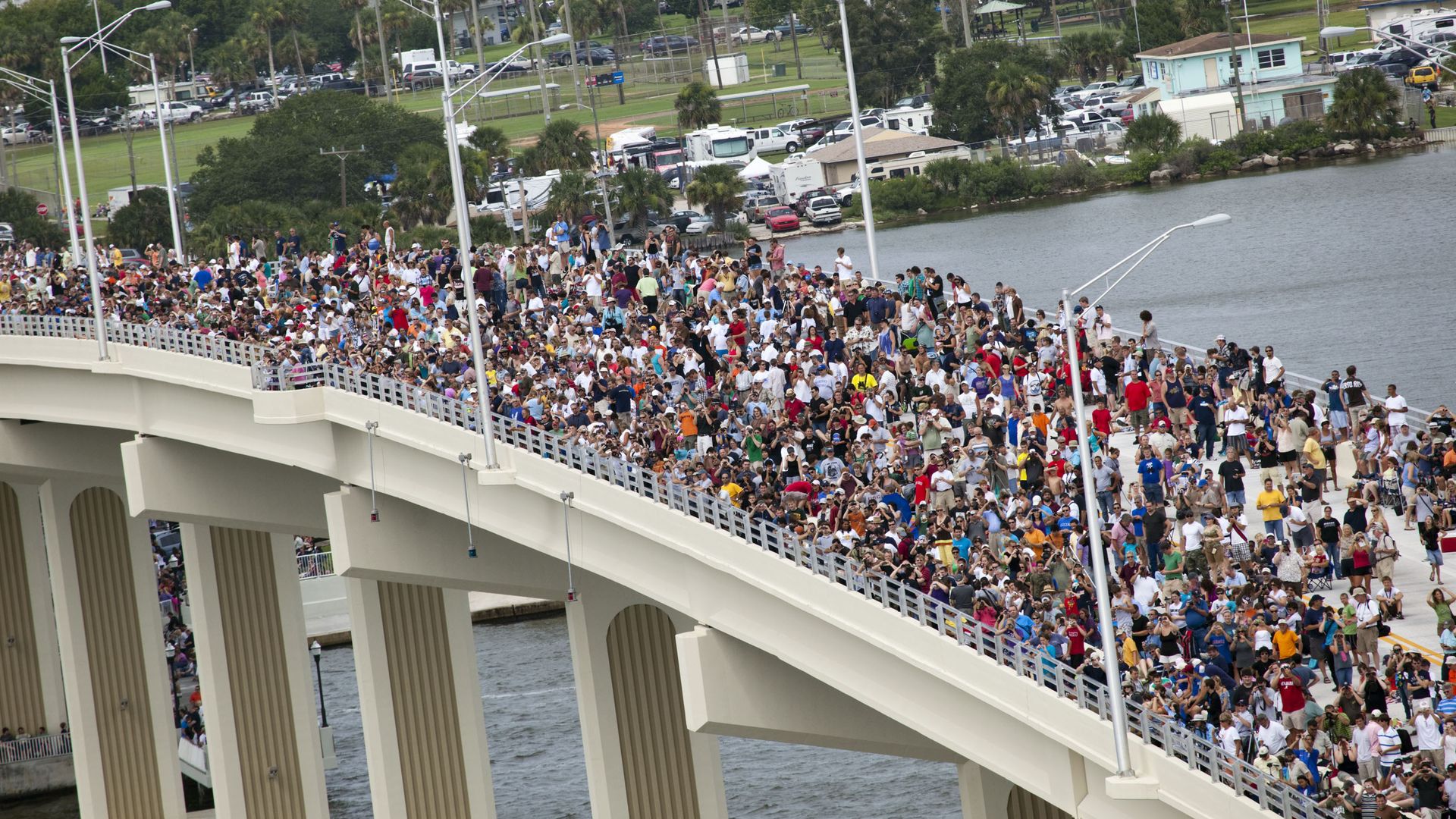A crowd on a bridge in Florida watching the final space shuttle launch in 2011. 