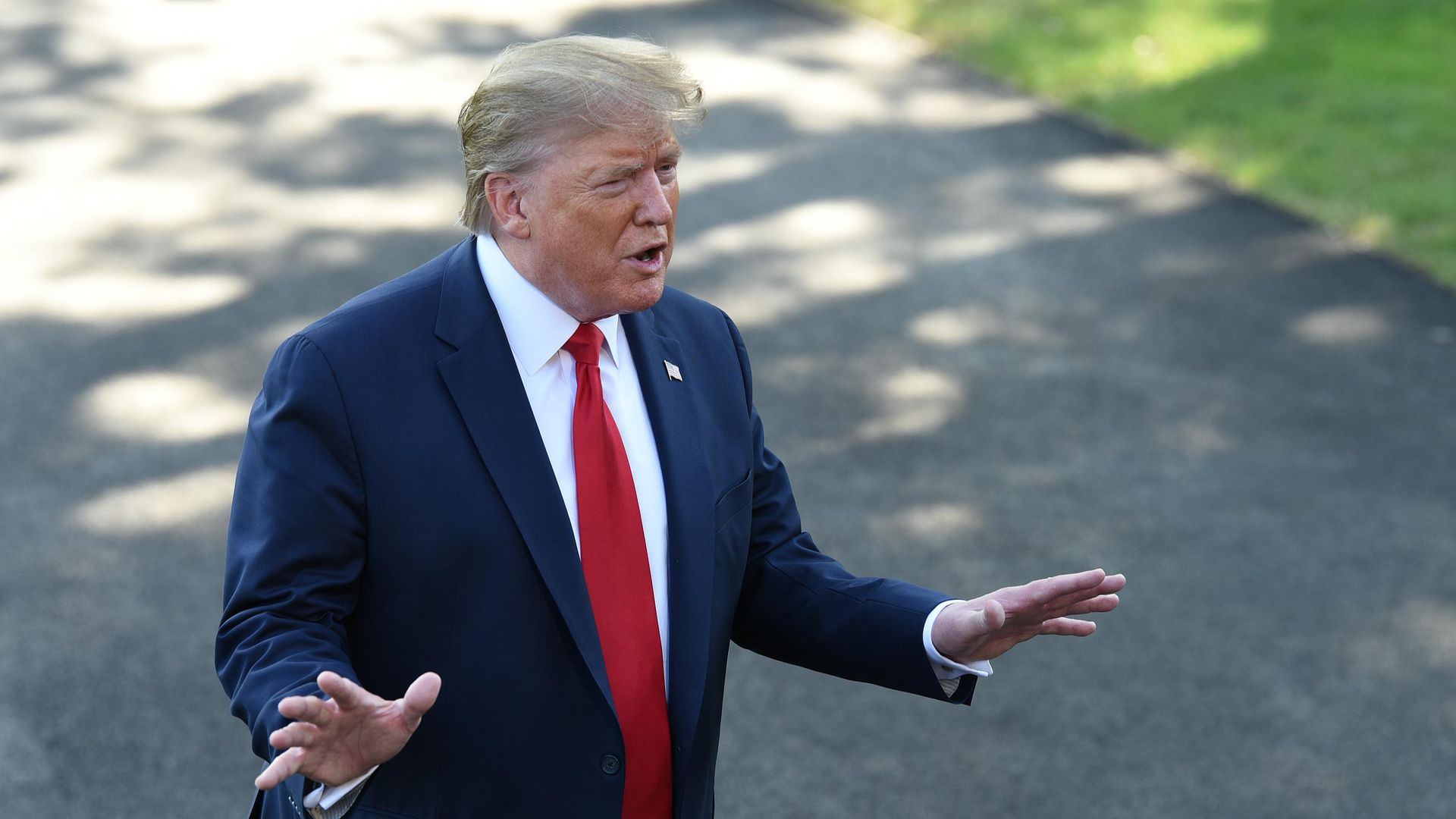 Trump speaking to reporters.