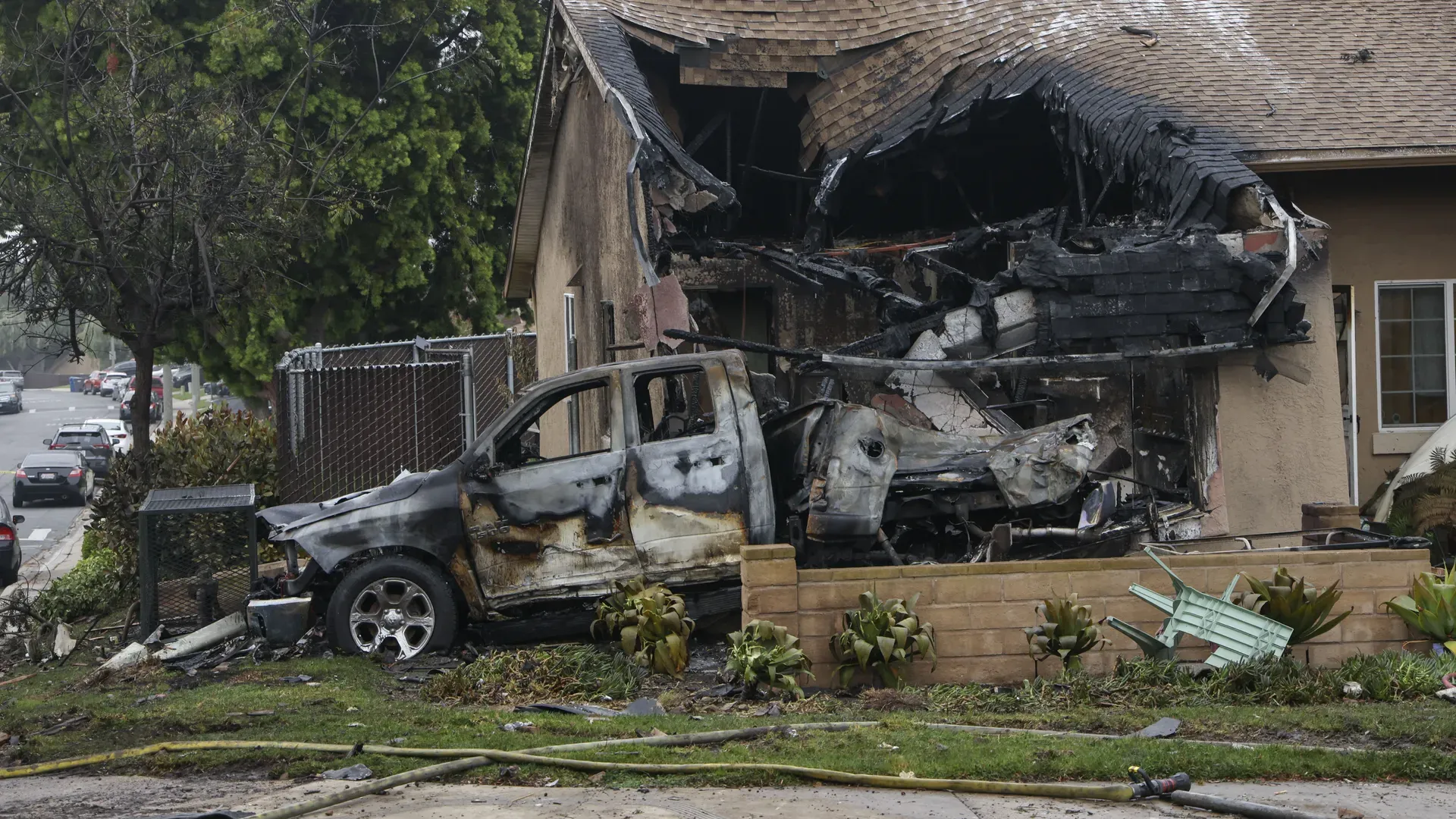 A home is partially destroyed where a small plane crashed into a San Diego