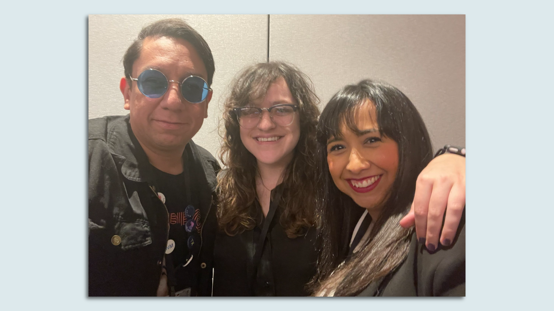 Russell Contreras, Marina E. Franco and Astrid Galvan hug for a photo