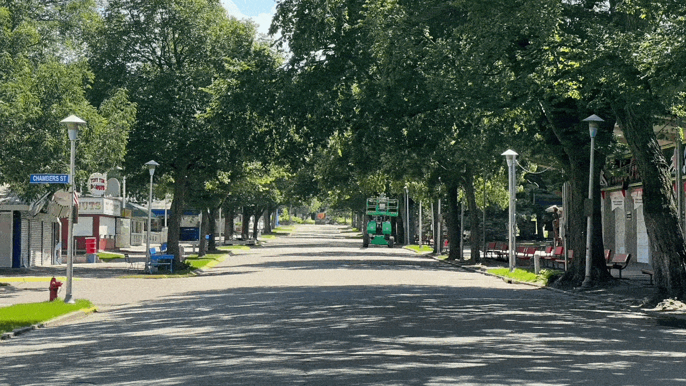 An animated image of an empty street transforming into a street filled with a large crowd of people