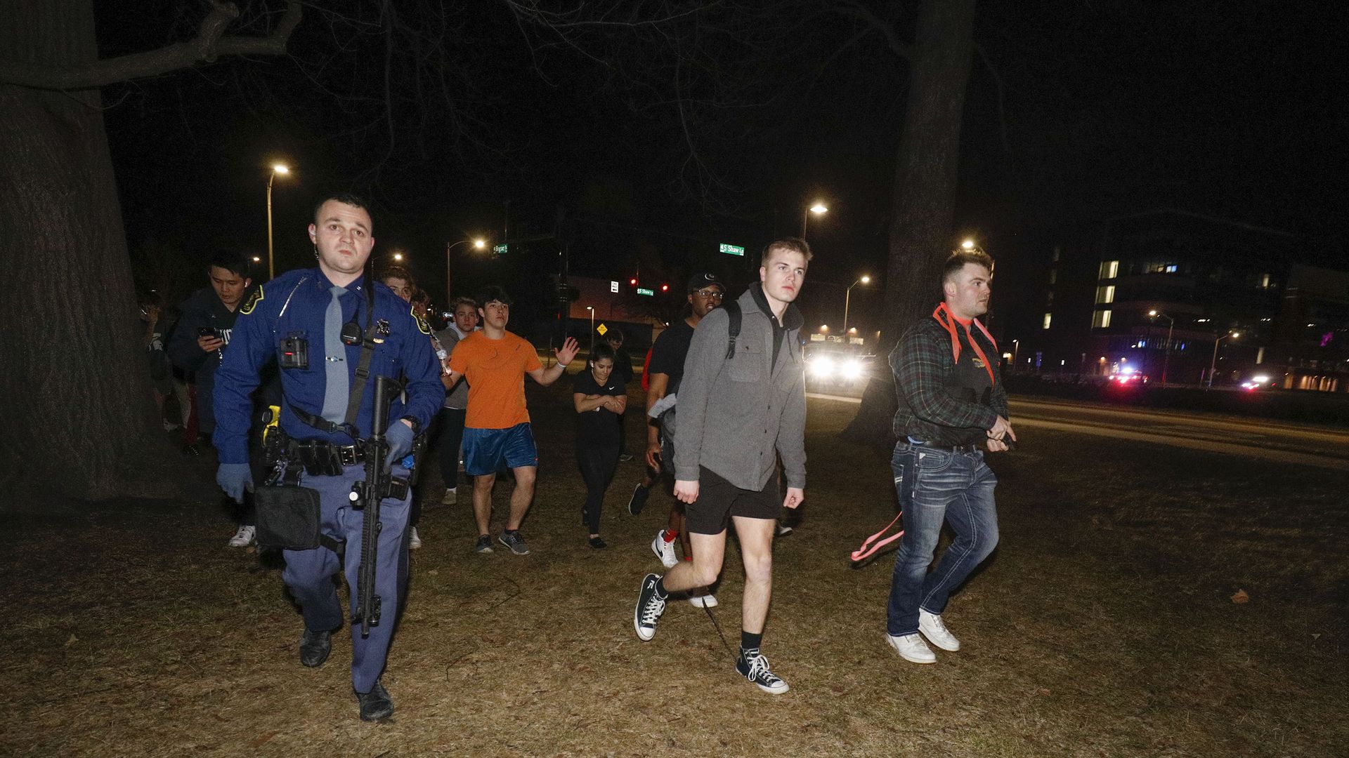 Michigan State University students are led to a safe area during an active shooter situation on campus on February 13, 2023 in Lansing, Michigan.