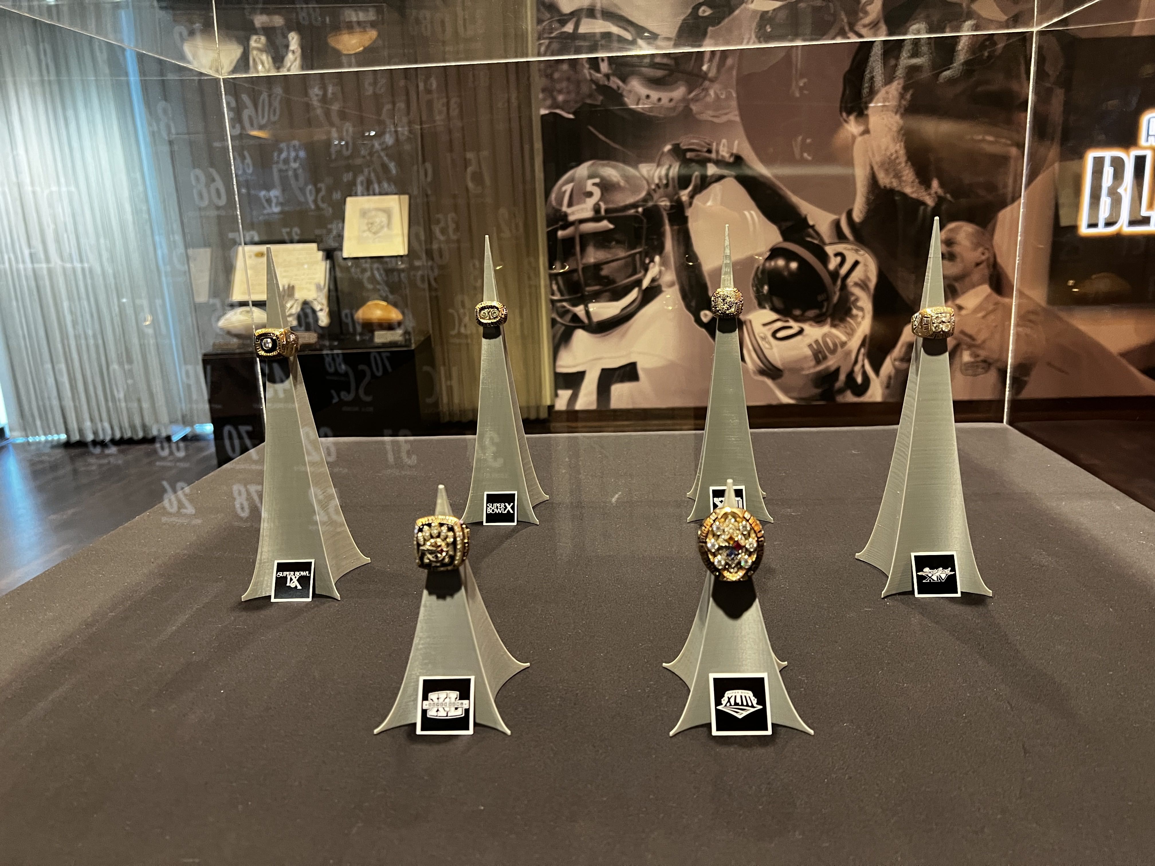 Super Bowl rings at Steelers hall of fam exhibit.