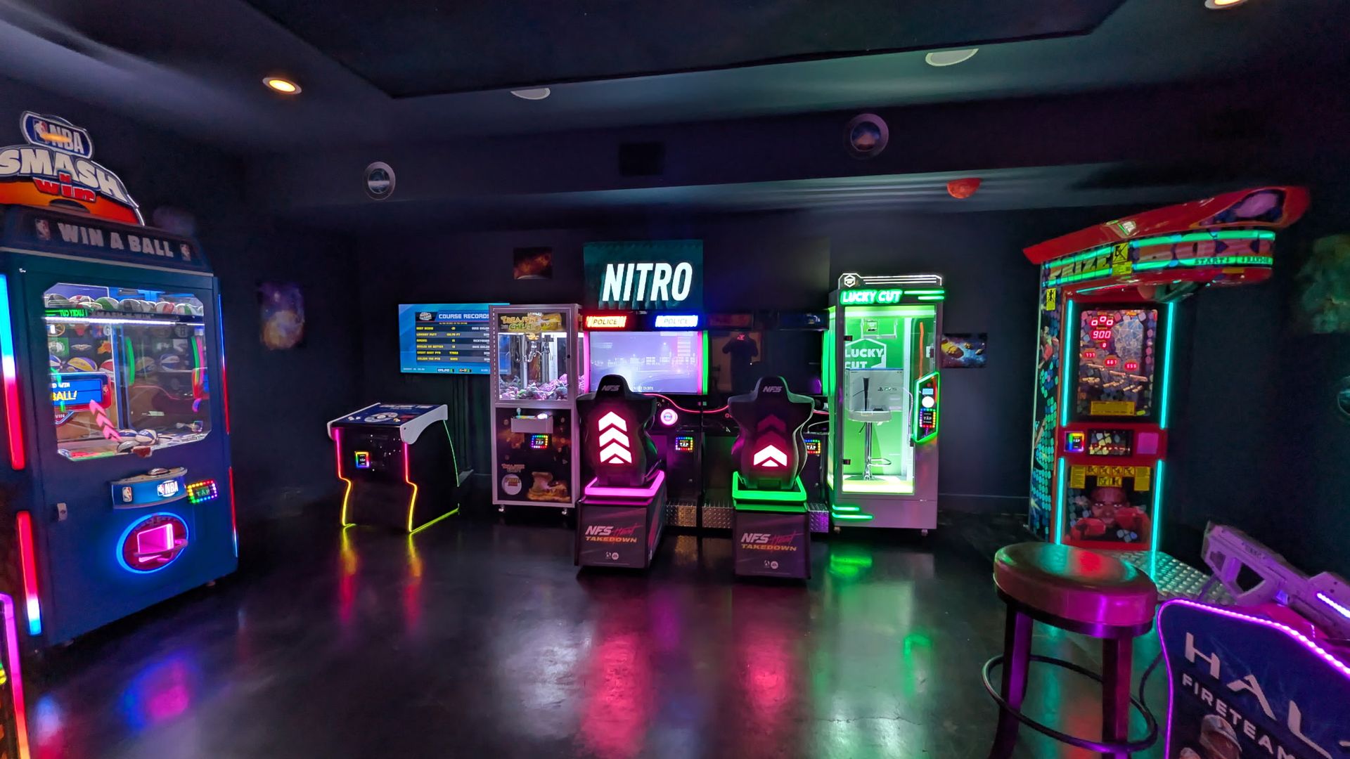 a bunch of arcade games in a bar