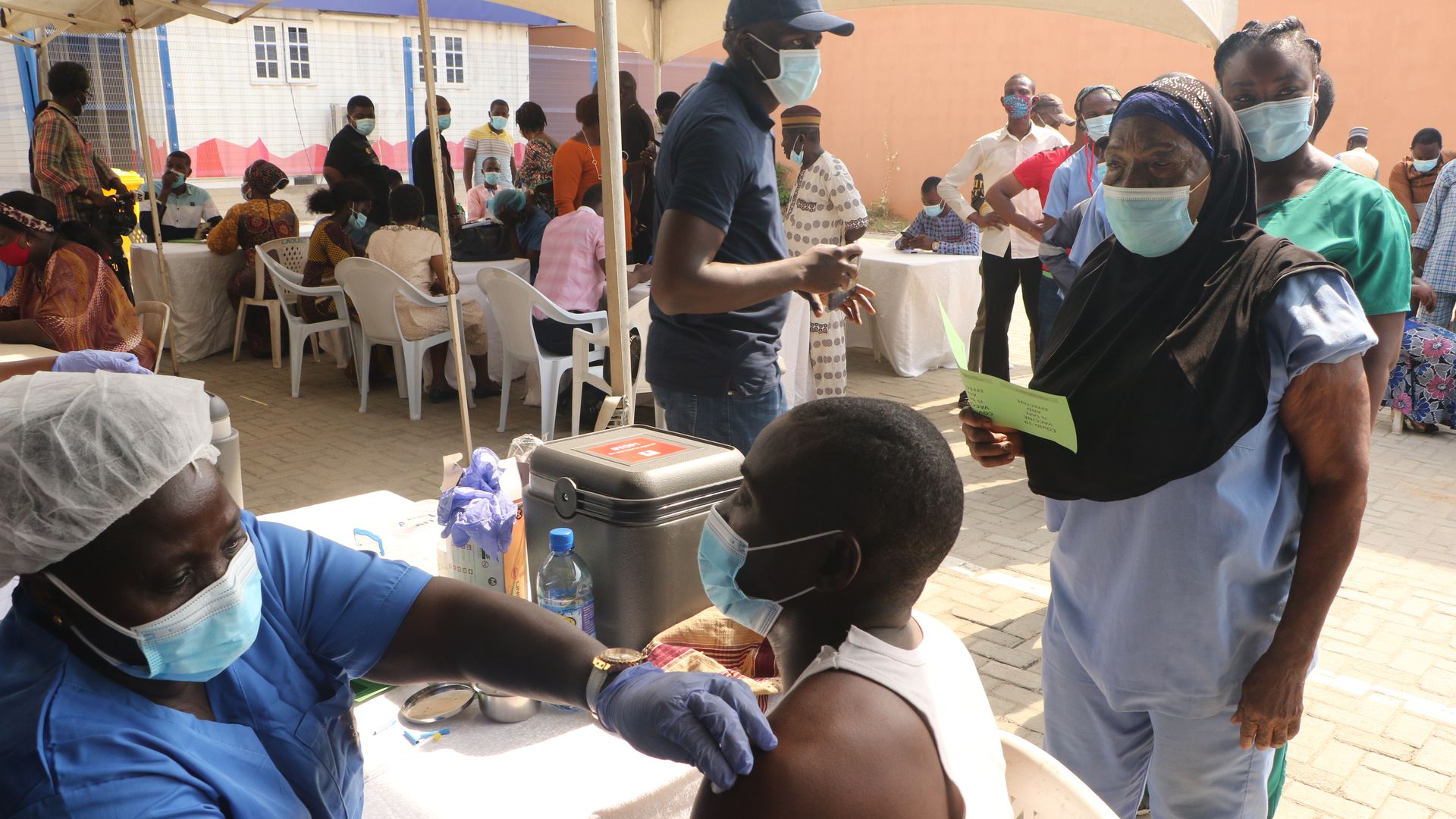 People queue for a COVID-19 vaccine in Lagos, Nigeria. 