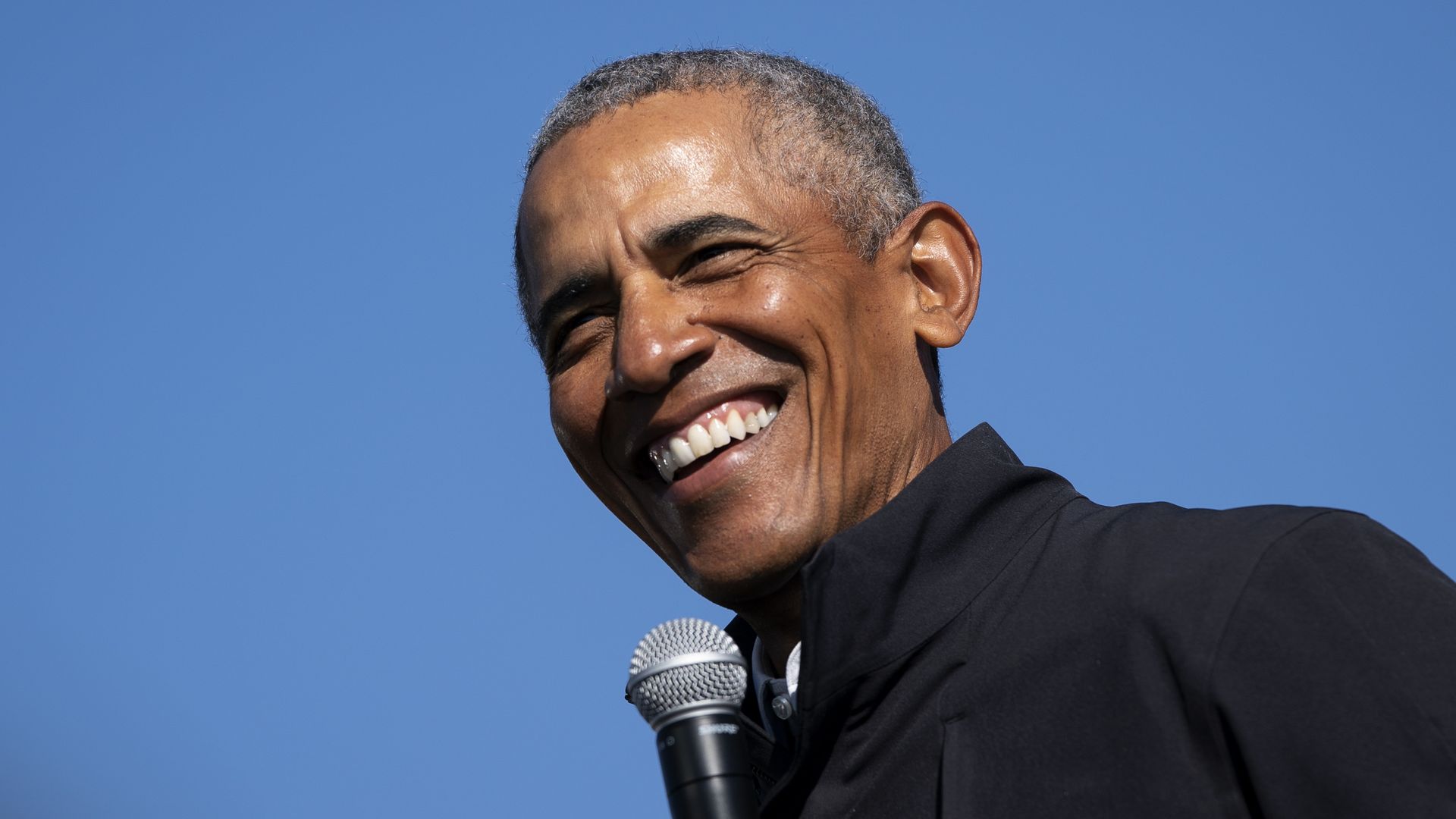 Former U.S. President Barack Obama speaks during a drive-in campaign rally for Joe Biden at Northwestern High School on October 31, 2020 in Flint, Michigan.