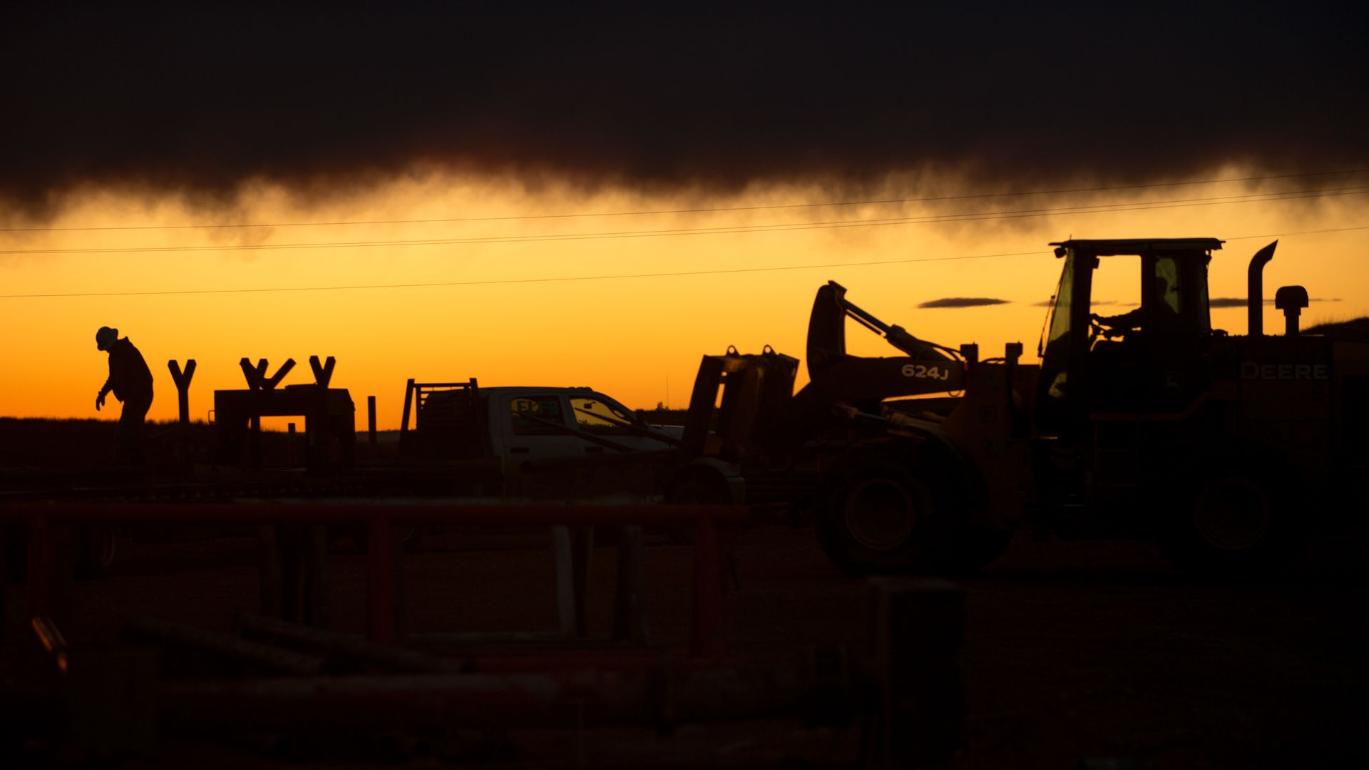 Workers silhouetted