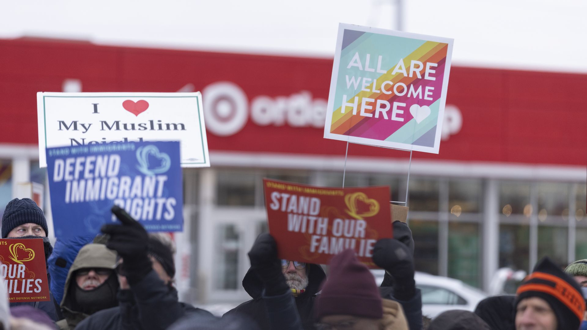 Demonstrators rally outside a Target in Minneapolis after ICE agents were spotted staging in the parking lot on Dec. 4, 2025. 