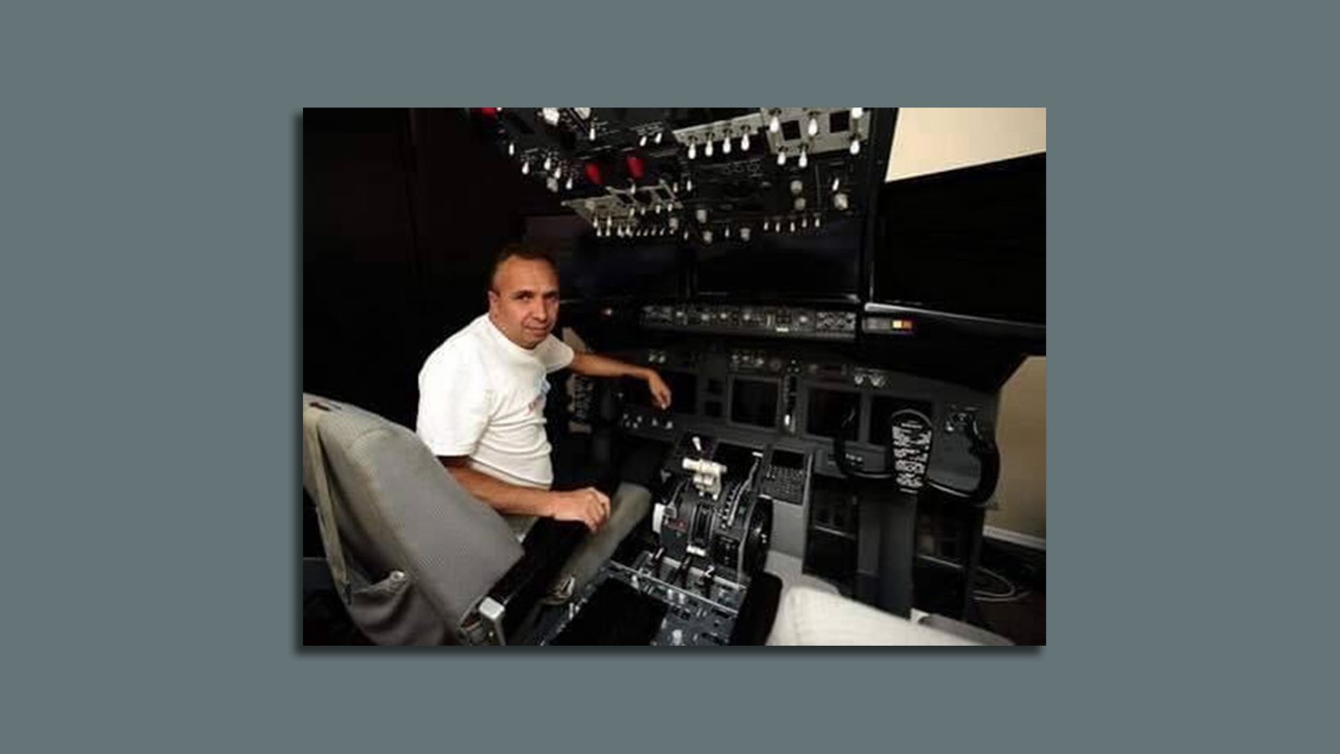 A dated photo of Peter Repak sitting in a cockpit.