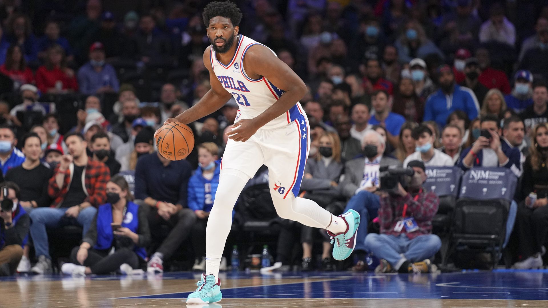 Joel Embiid of the 76ers dribbles the ball against the Minnesota Timberwolves 