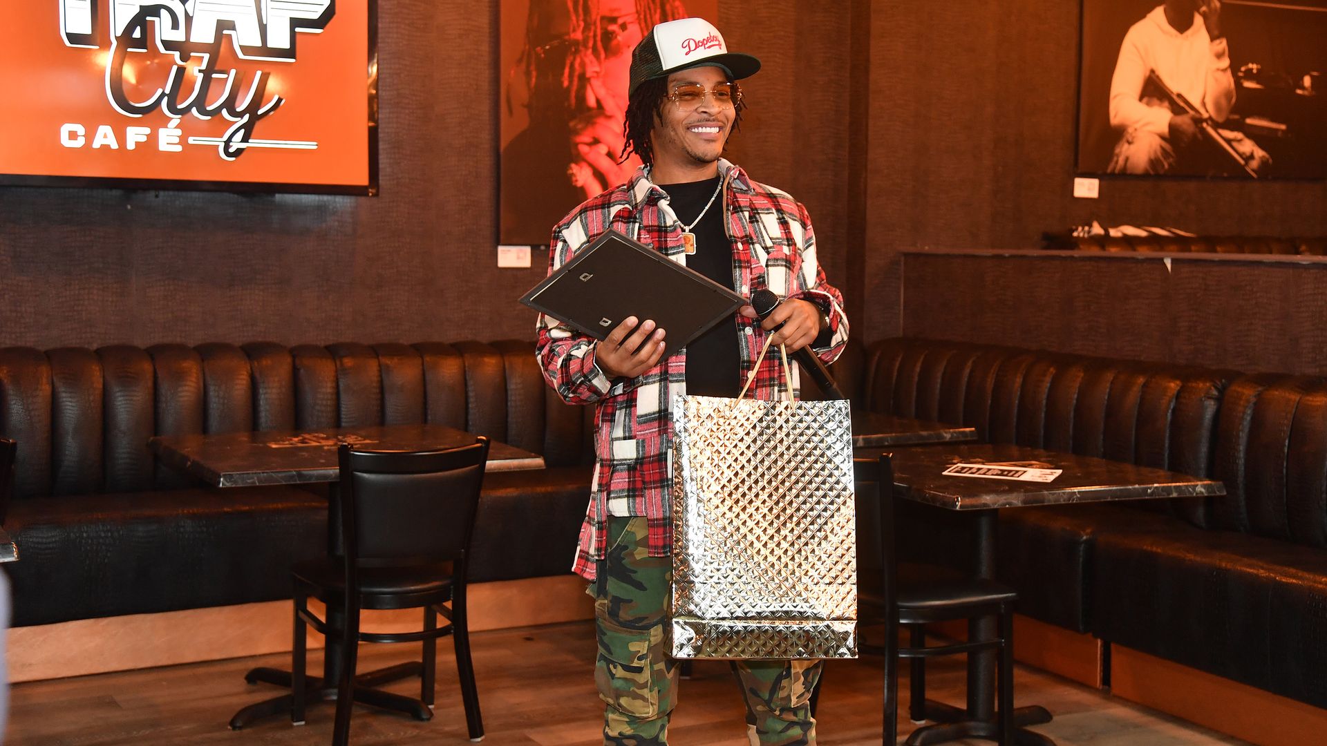 The rapper T.I. hands out holiday gifts.