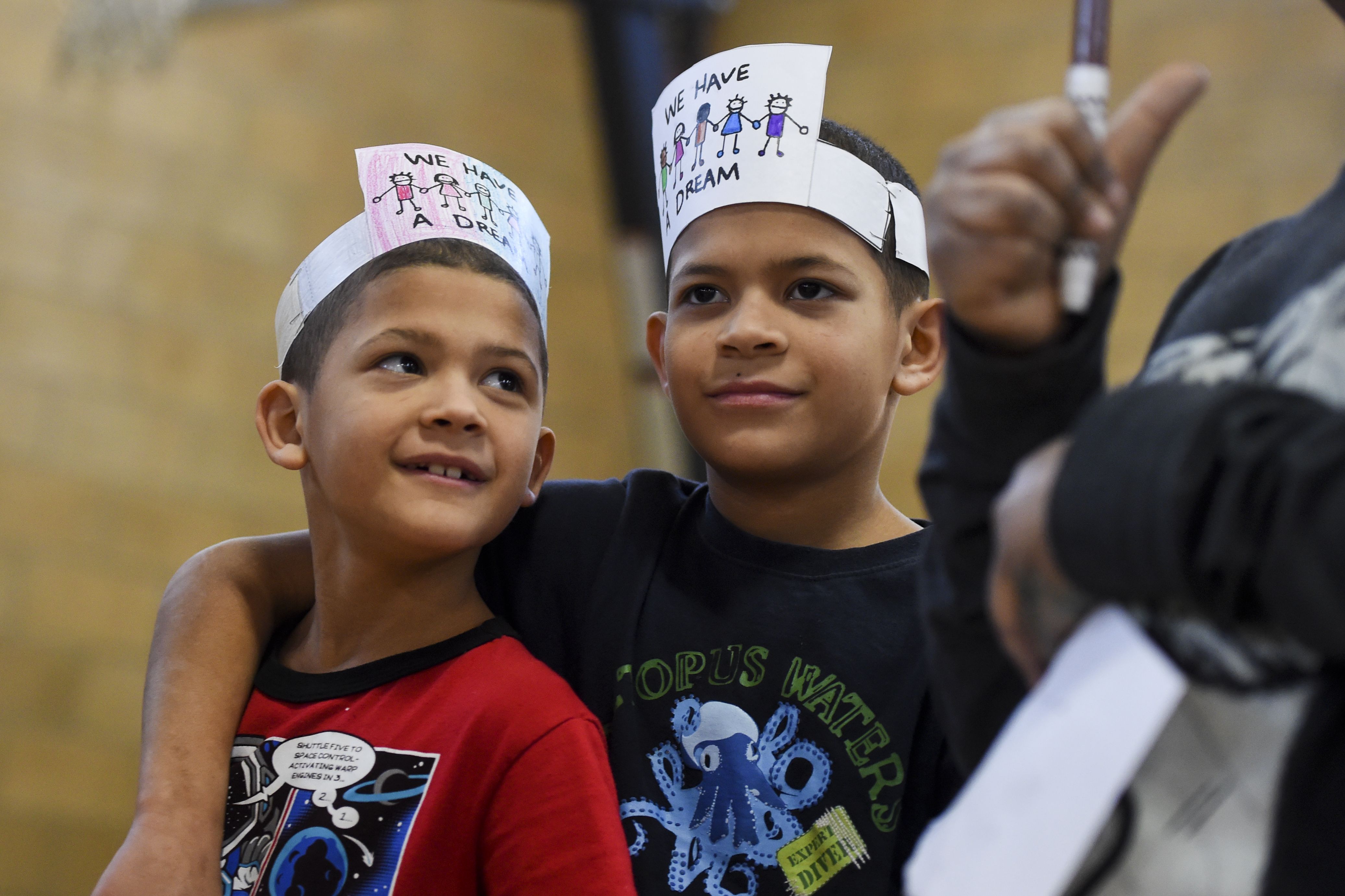 Javen Lopez, 9, left, smiles with his brother, Julian, 11, during a Martin Luther King Jr. birthday celebration.