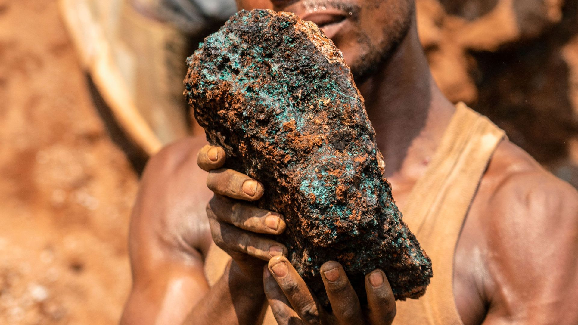 Miner in Congo holding cobalt