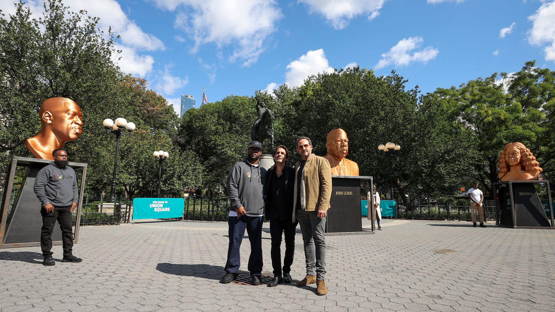George Floyd's brother Terrence Floyd and Artist Chris Carnabuci attend the ceremony of placing statues at Union Square in New York City