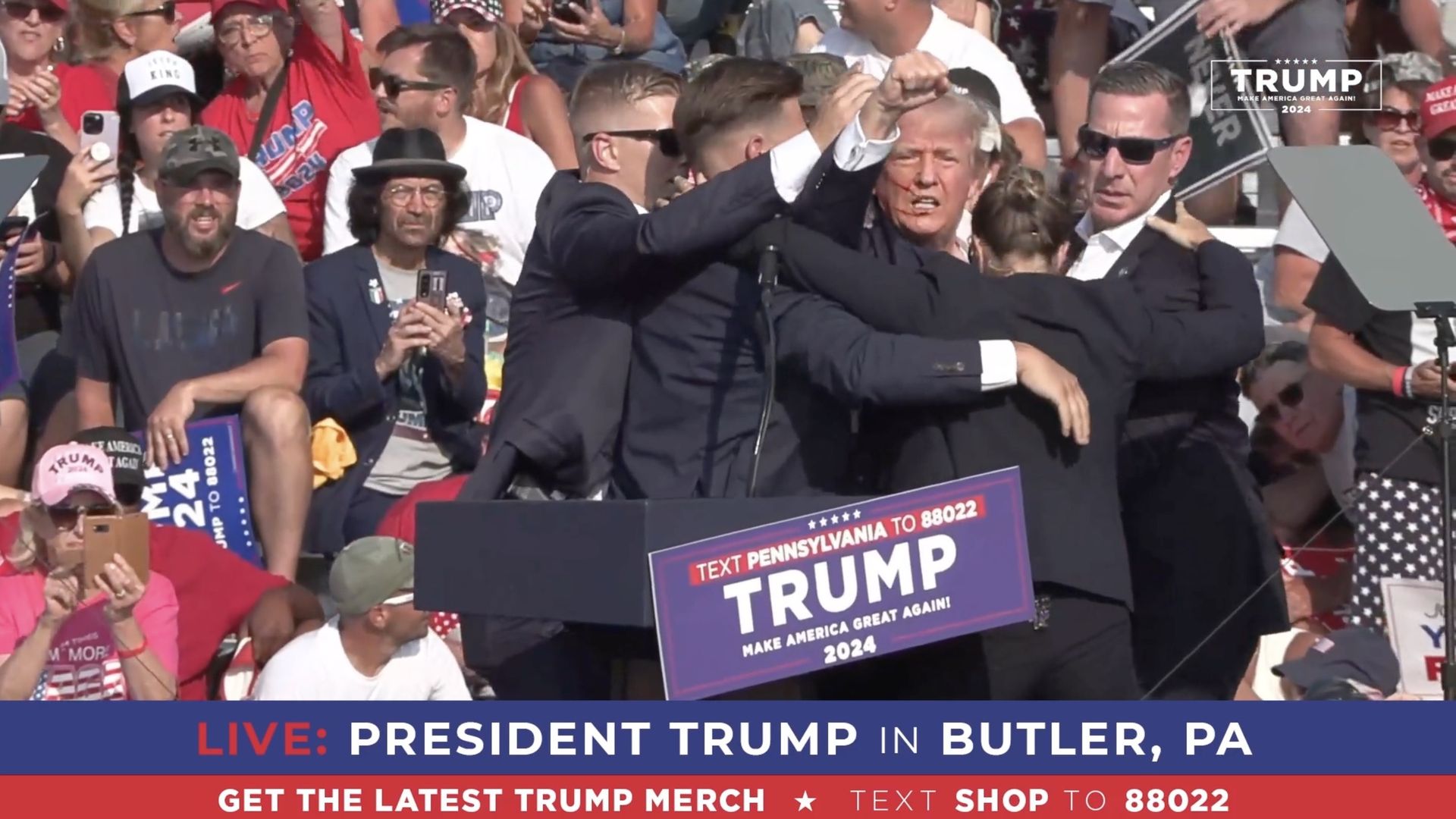 A screen grab captured from a video shows former President Trump  being escorted off stage by Secret Service agents after an assassination attempt in Butler, Pa., n July 13, 2024.