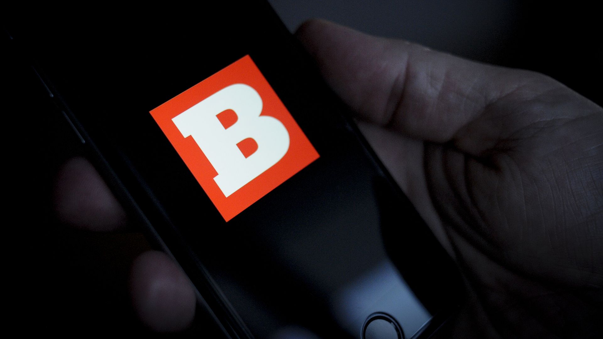 The Breitbart logo is seen on an iPhone