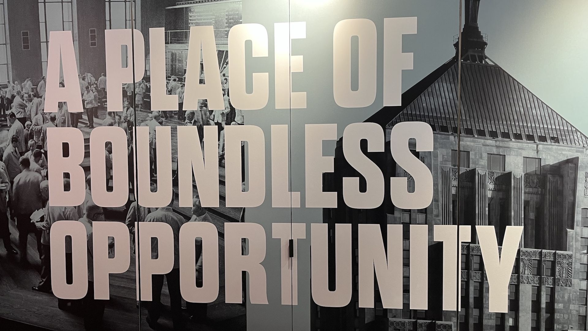 "A Place of Boundless Opportunity" on top of a black and white photo of the Chicago Board of Trade Building.