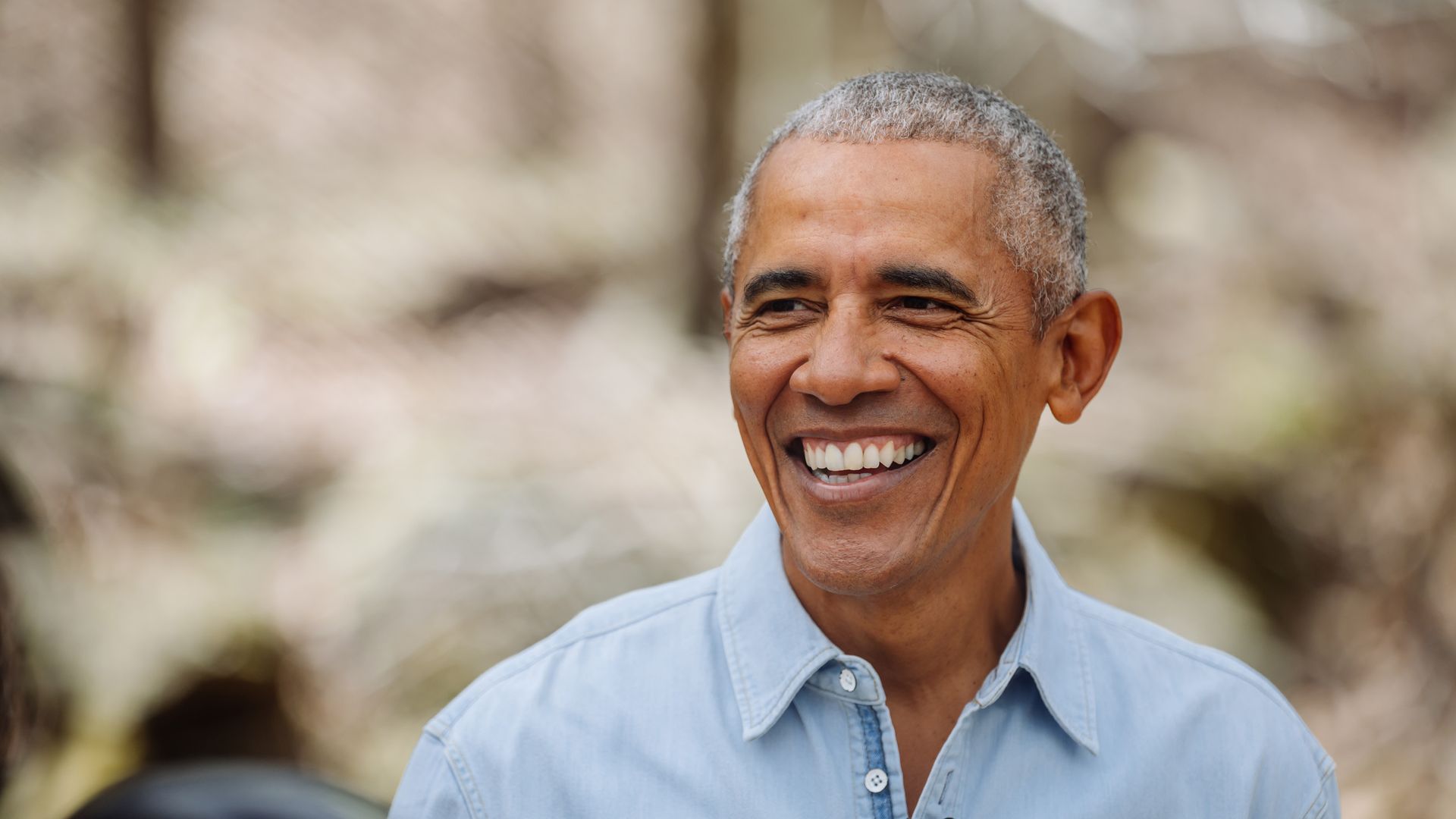 Former President Obama smiling at Boys and Girls Club event
