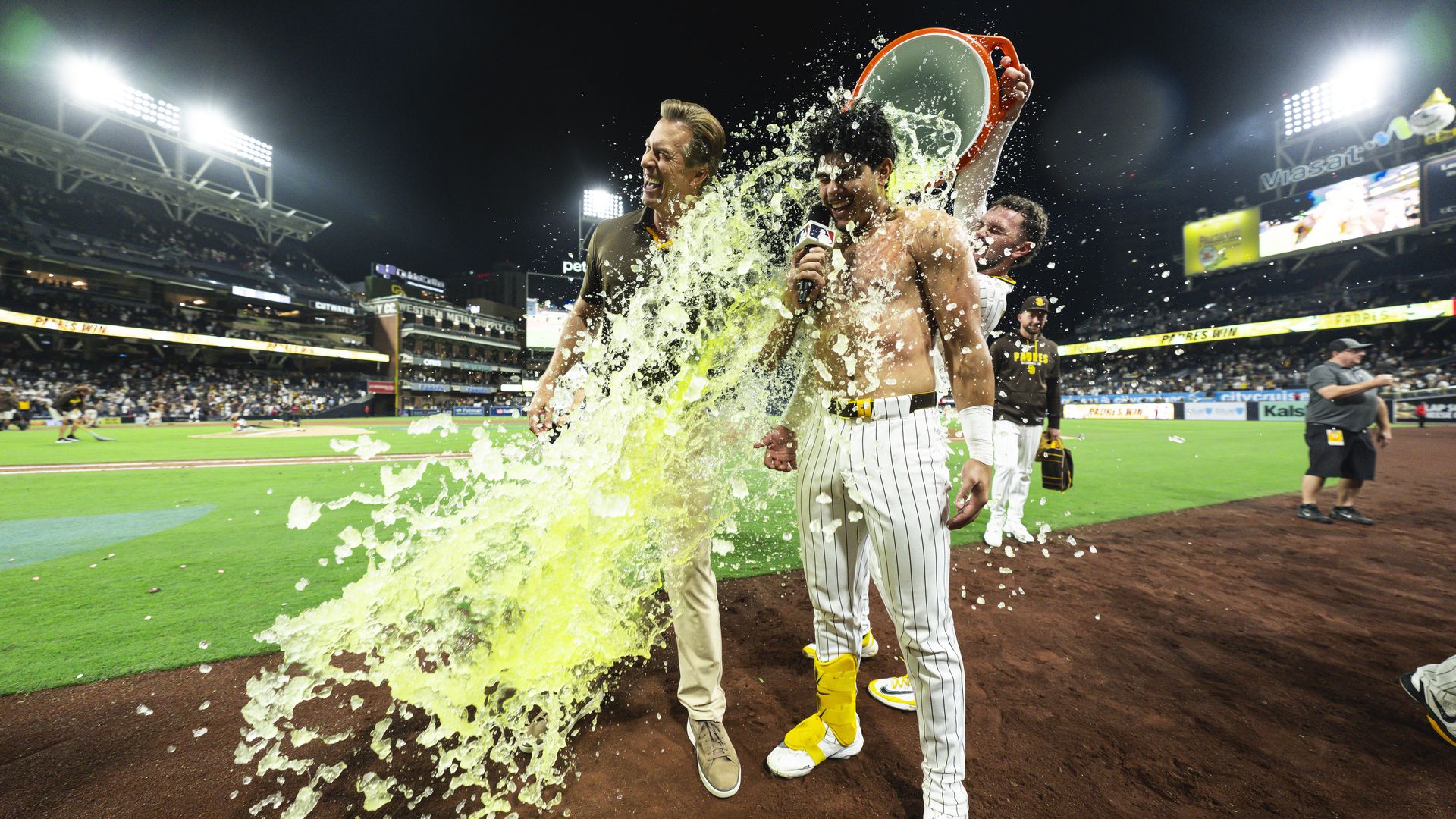 Ethan Salas #8 of the San Diego Padres is doused by Jackson Merrill #3 after hitting a walk-off single in the tenth inning against the Miami Marlins at Petco Park on September 19, 2026 in San Diego, California. (Photo by Orlando Ramirez/Getty Images)