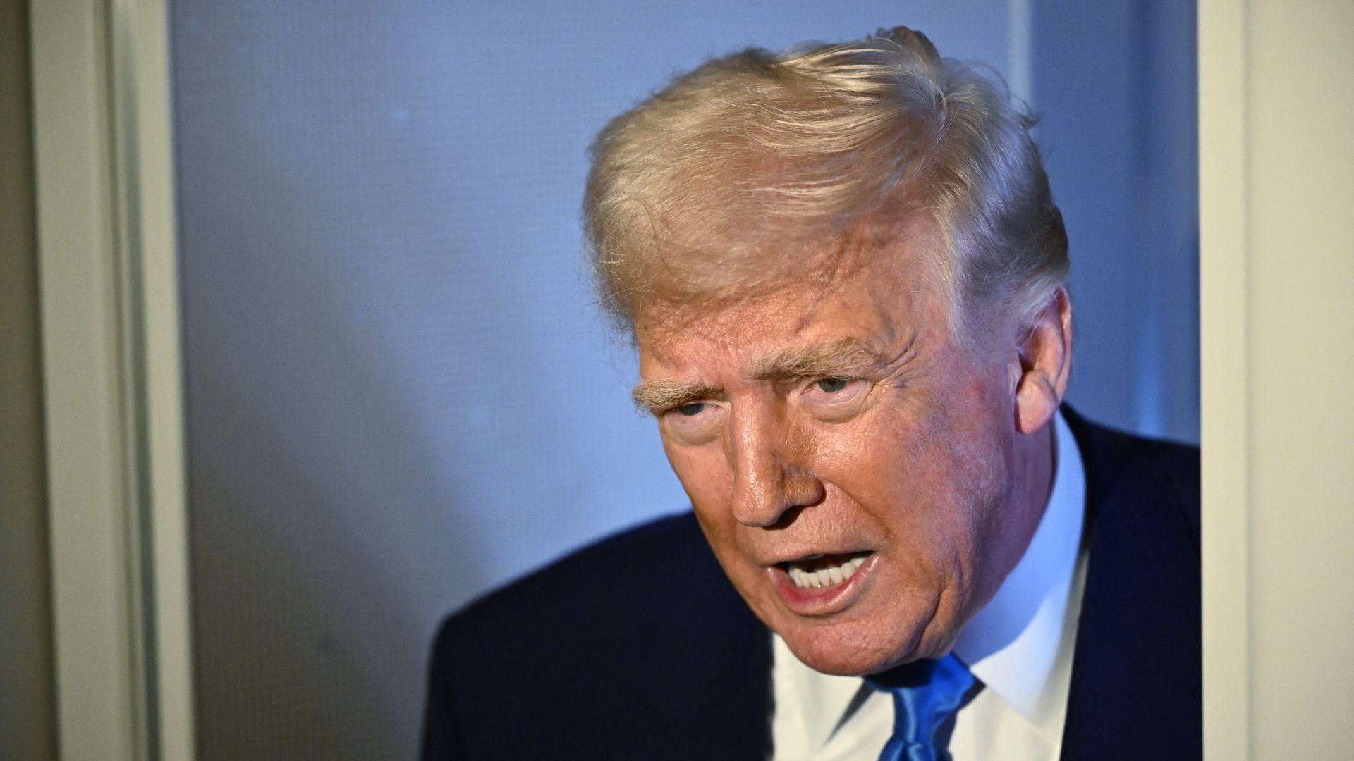 President Trump speaks to reporters on Air Force One.