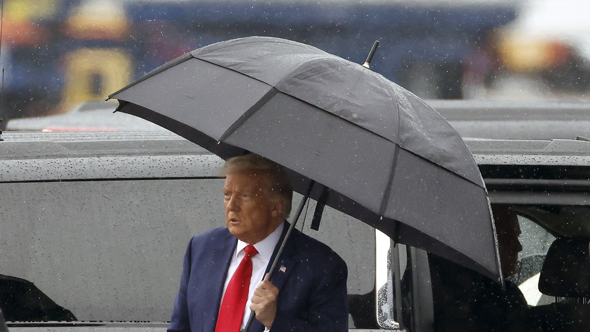 Trump with an umbrella