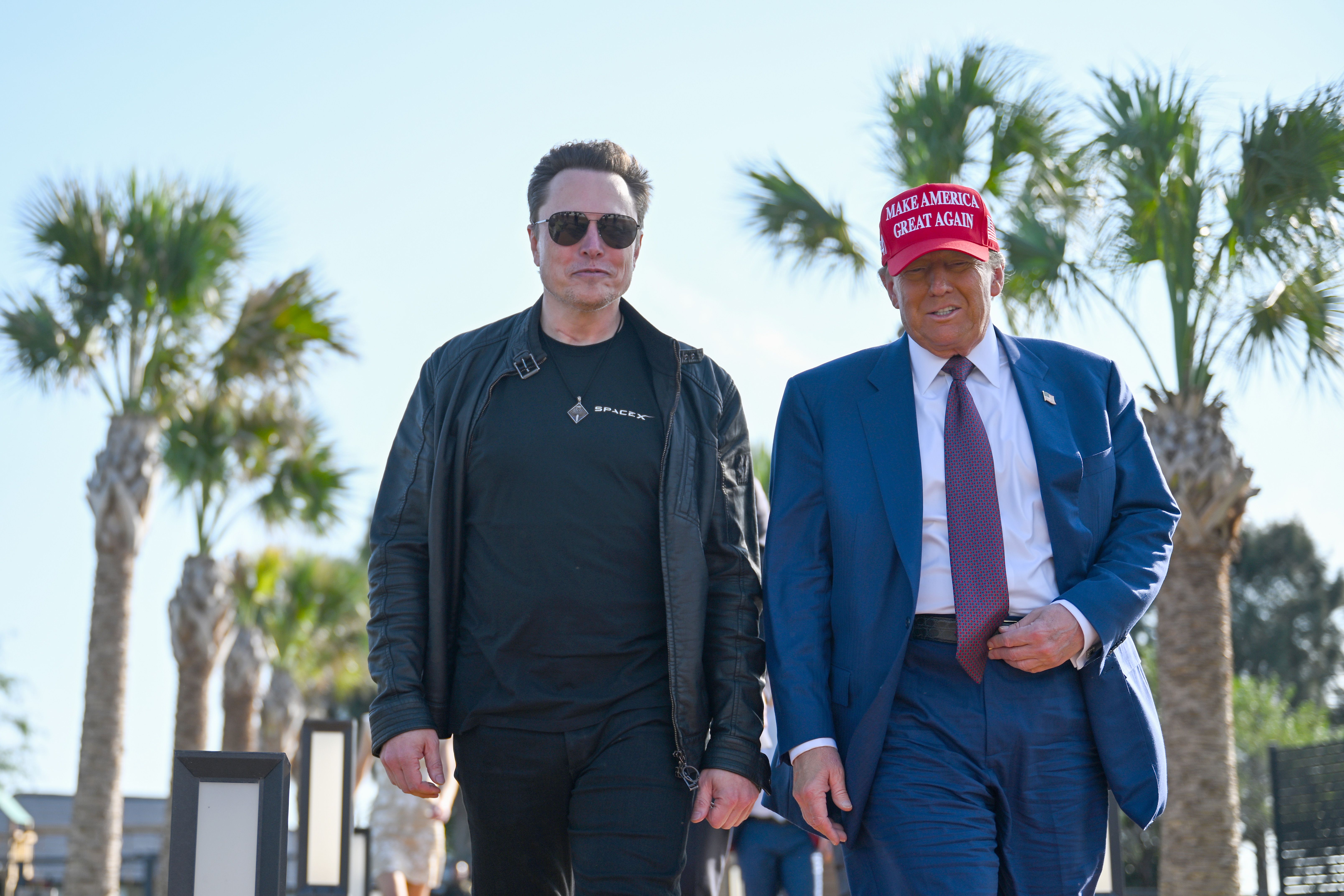 resident-elect Donald Trump greets Elon Musk as he arrives to attend a viewing of the launch of the sixth test flight of the SpaceX Starship rocket on November 19, 2024 in Brownsville, Texas. SpaceX's billionaire owner, Elon Musk, a Trump confidante, has been tapped to lead the new Department of Gov