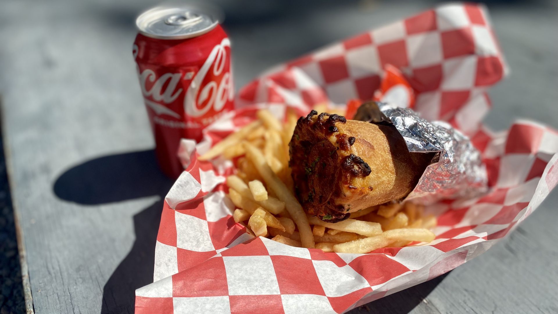 A pizza cone, fries and a Coke