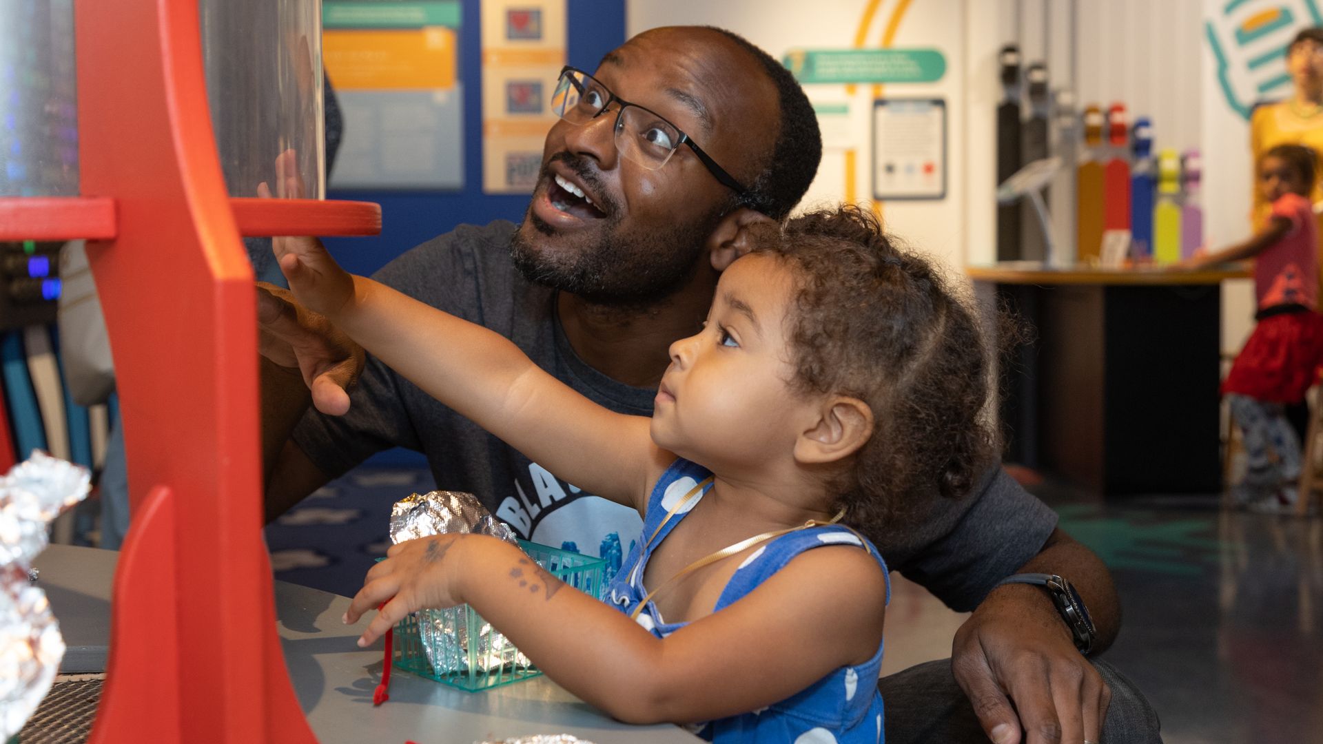 Father and child playing at the Discovery Place exhibit inside the Heinz History Center in Pittsburgh, Pa.