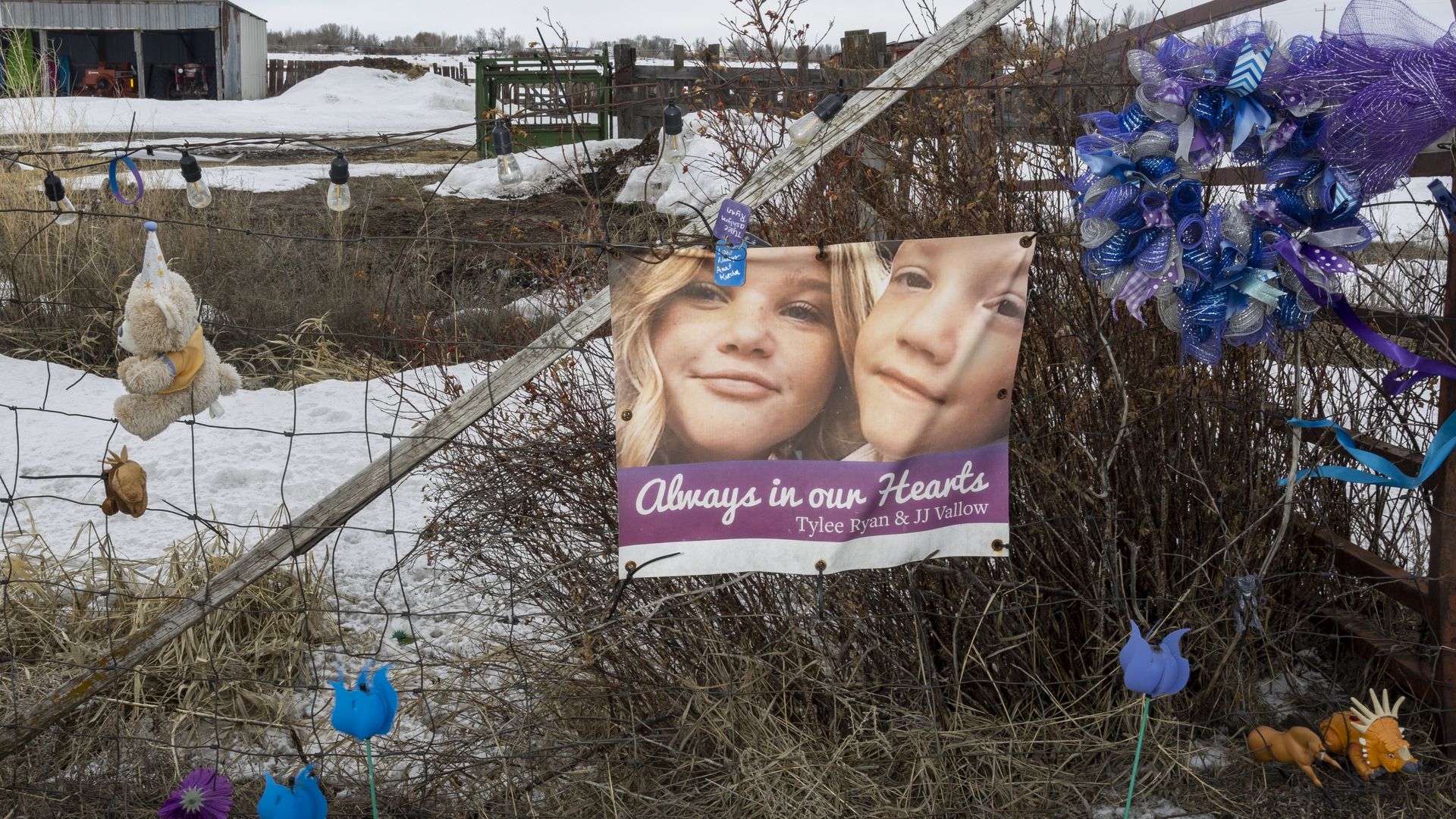 A gate with a photo of children.