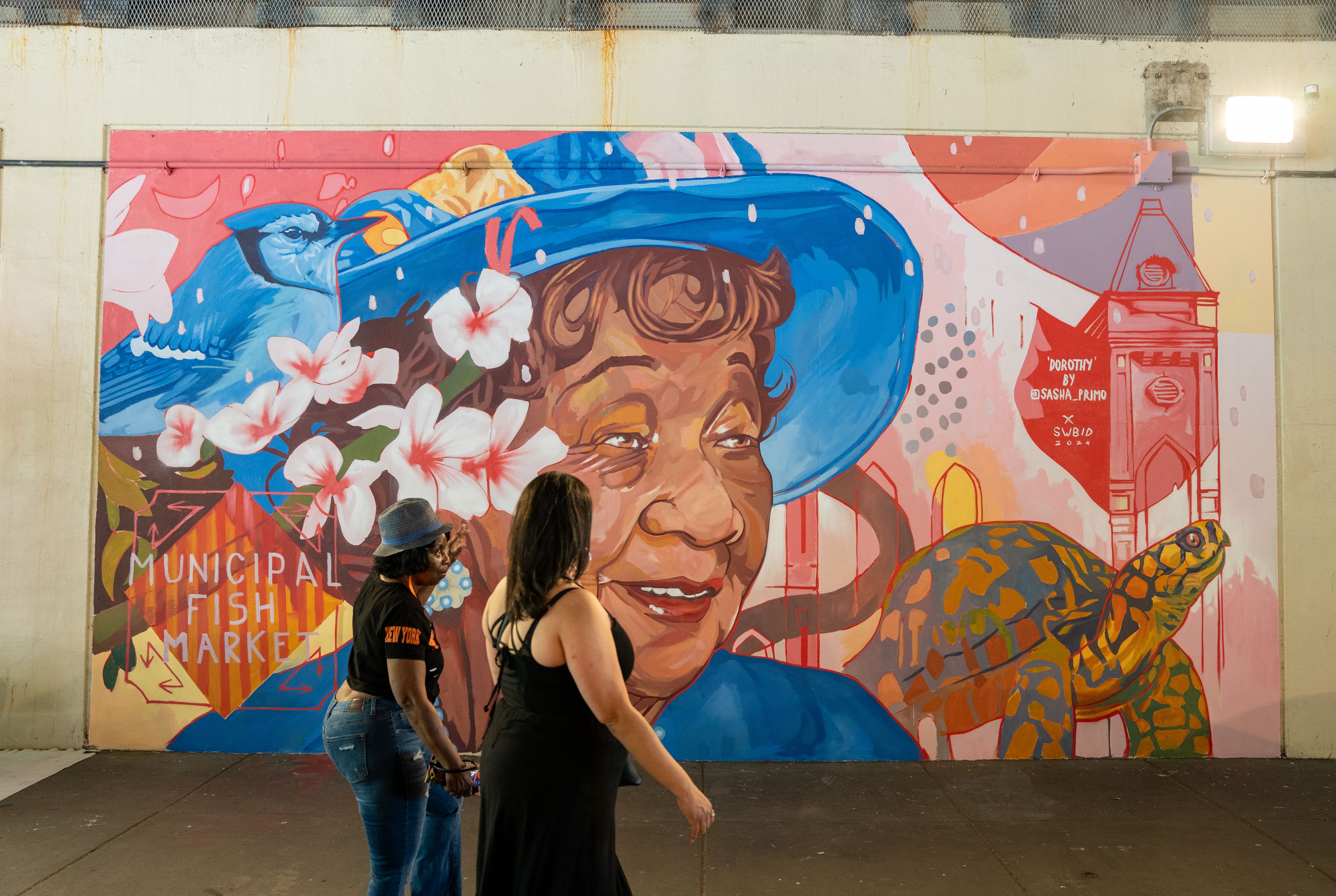 A colorful mural featuring a portrait of Dorothy Height.