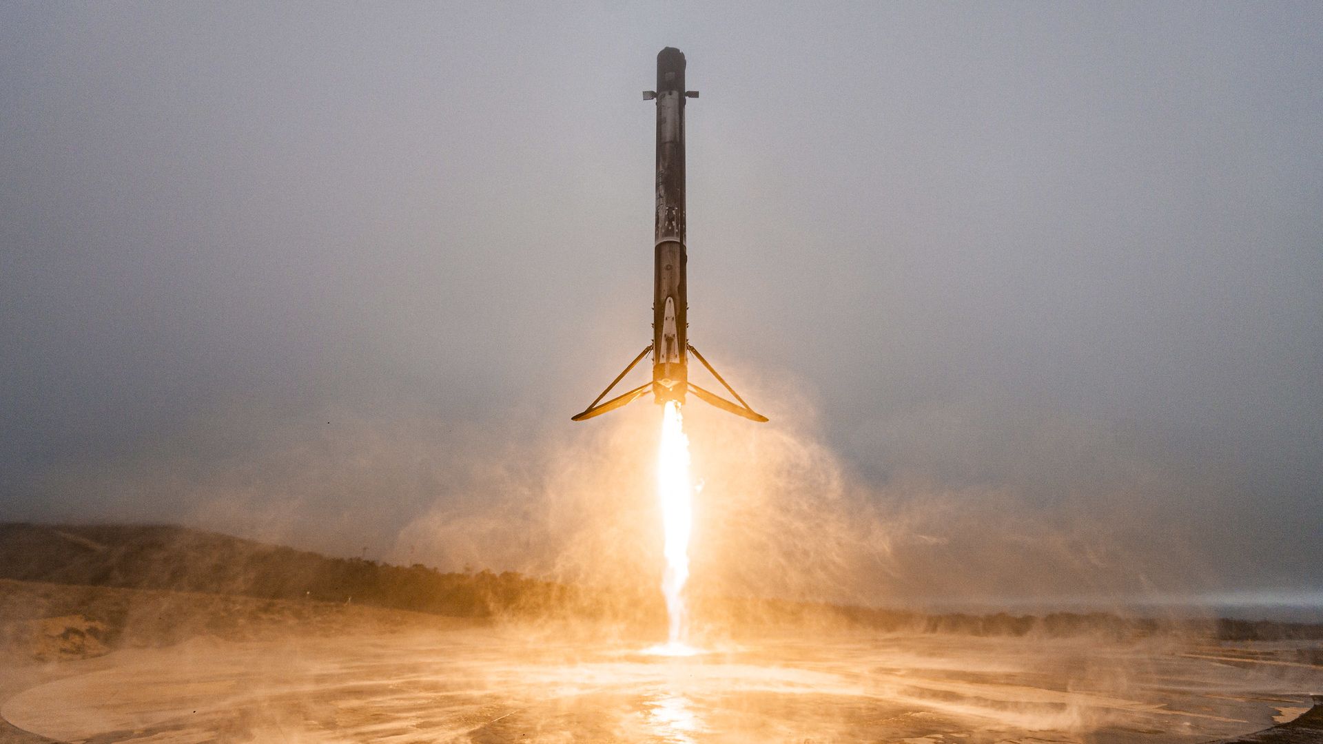 A Falcon 9 booster coming in for a landing on land