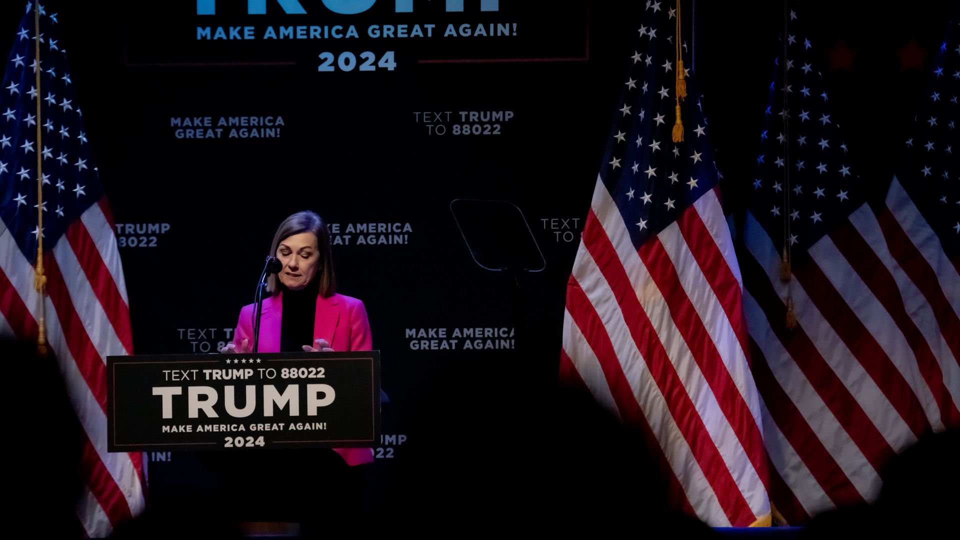 Kim Reynolds at trump podium