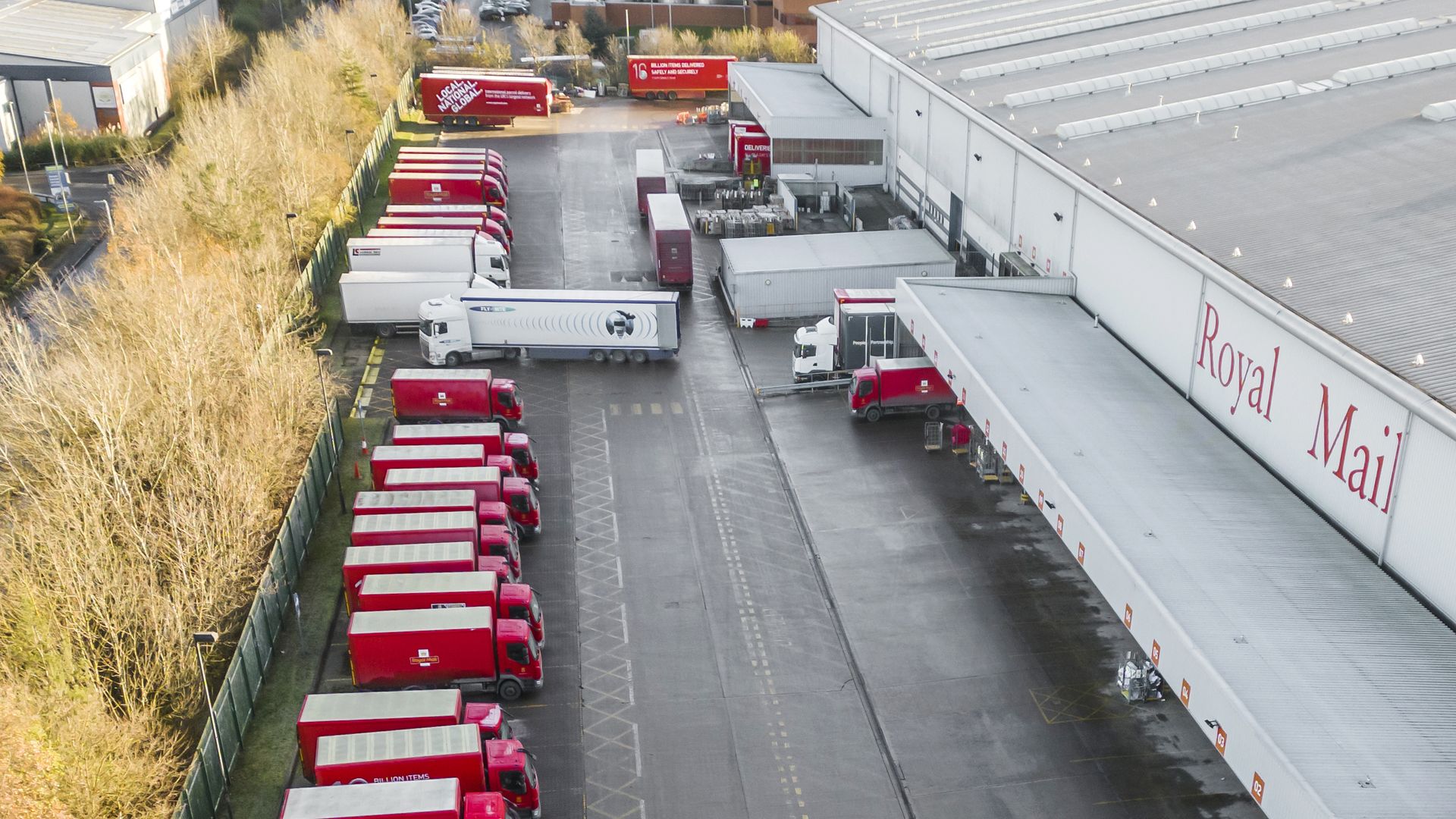 Royal Mail vehicles at Leeds Mail Centre in Leeds, as Royal Mail workers go on strike