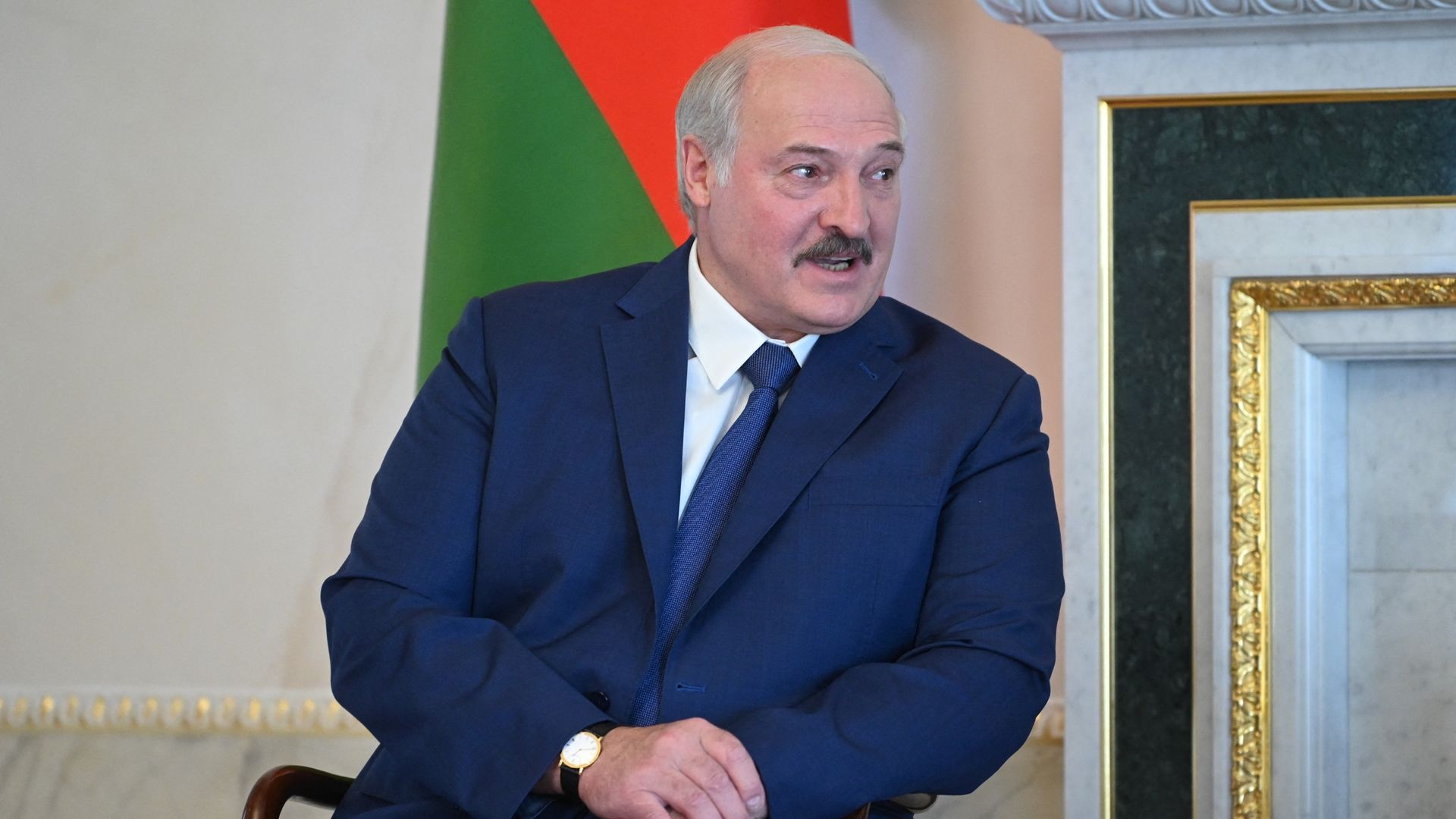 Belarus President Alexander Lukashenko talks as he meets with his counterpart, Russia's Vladimir Putinin Saint Petersburg on July 13, 2021.