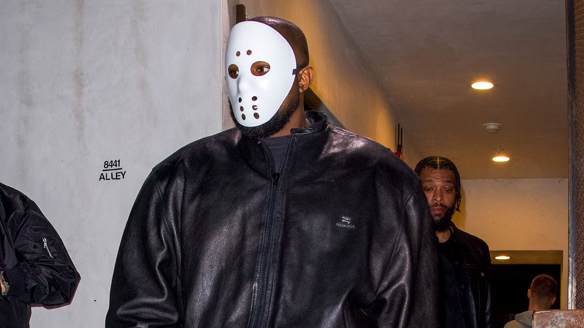 Photo of a man wearing a hockey mask